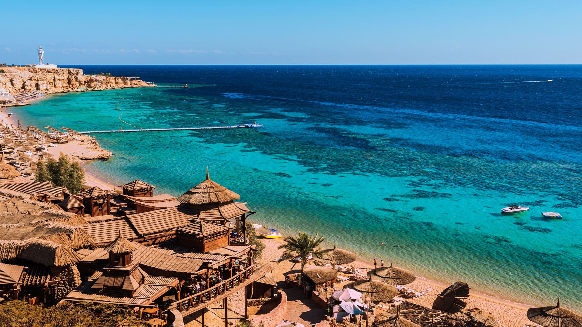 overlooking the golden sands and umbrellas of Egypt's Sharm el Sheikh overlooking the clear waters of the Red Sea