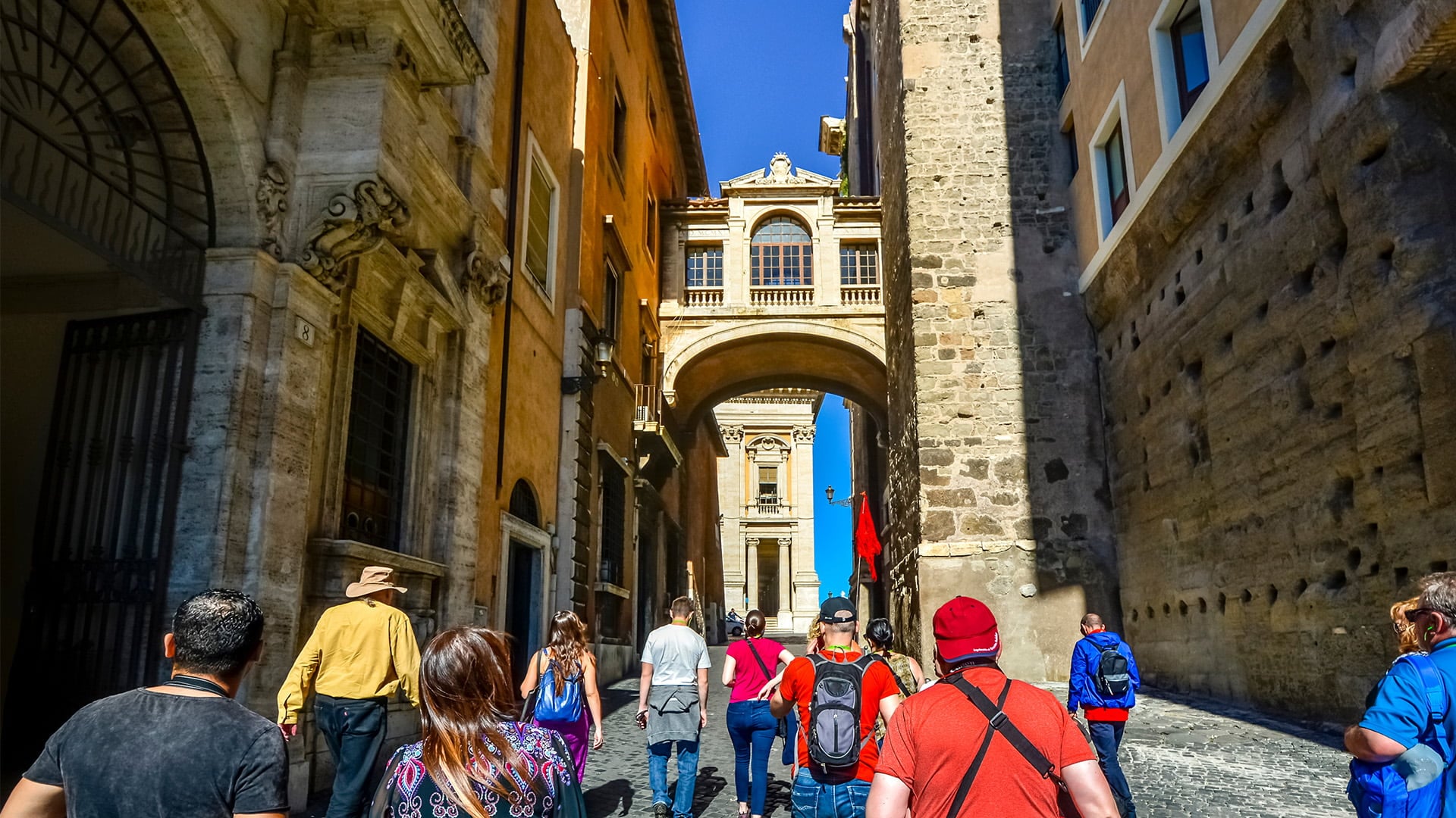 Group of tourists walking through a European city
