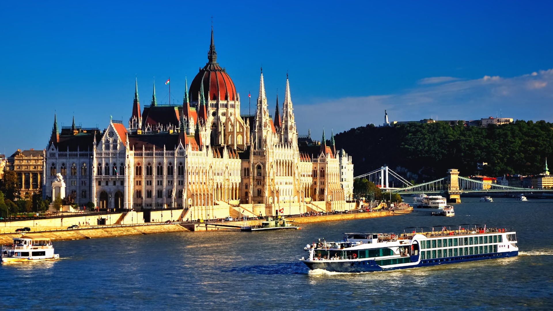 A cruise ship passes along the Danube in Budapest, Hungary