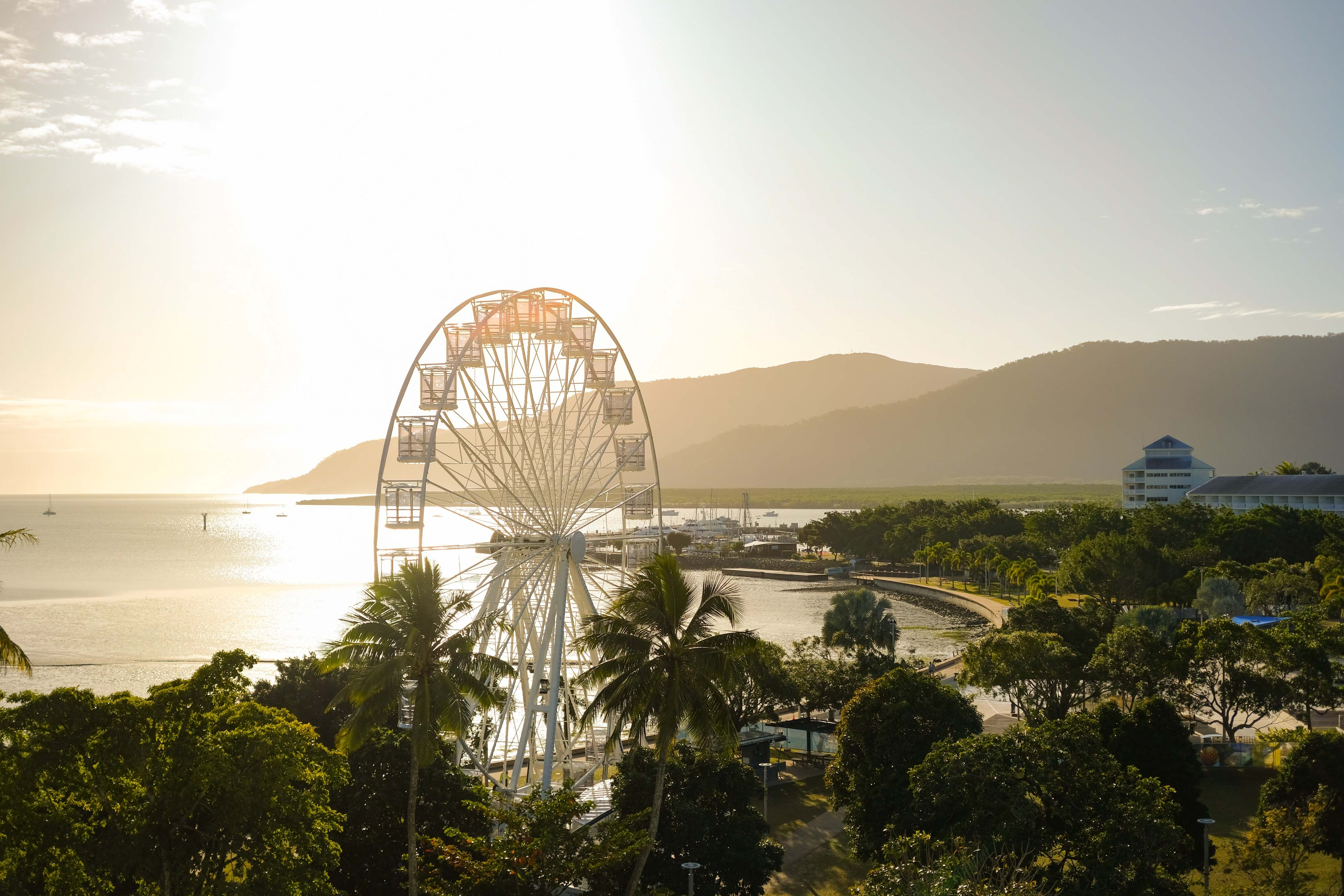 View of a ferris wheel at the Cairns Esplenade in Cairns, Queensland, Australia, at sunset,