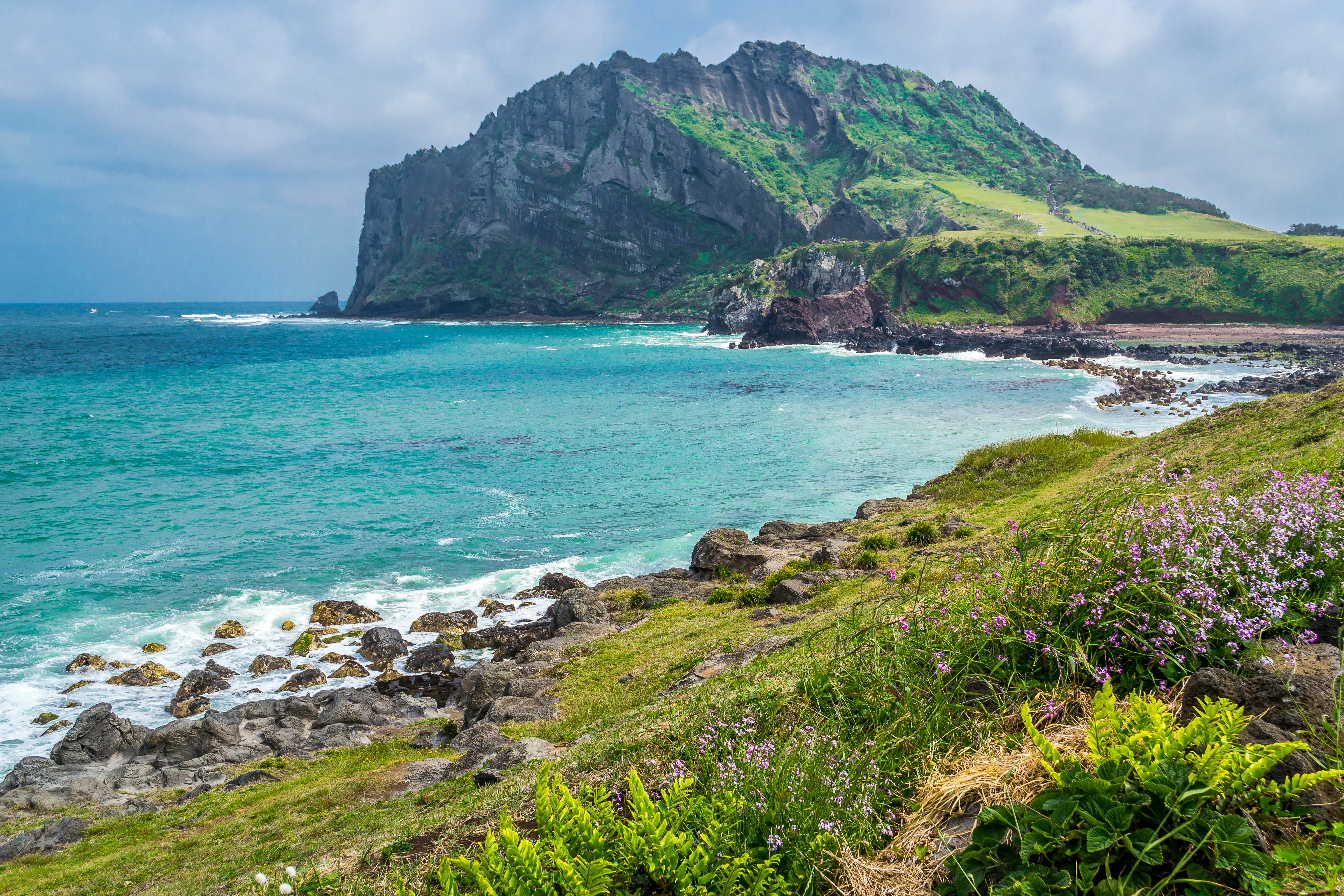 View of Seongsan Ilchulbong Peak on Jeju Island, South Korea, from the coast.