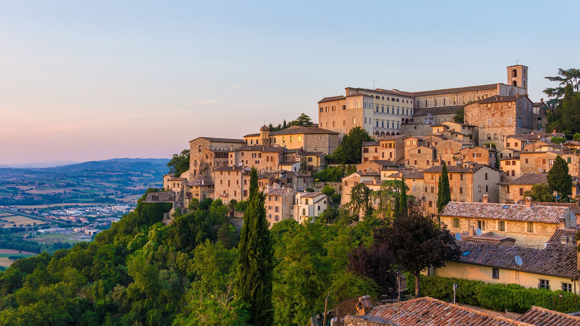 medieval town at the top of a hill overlooking valley