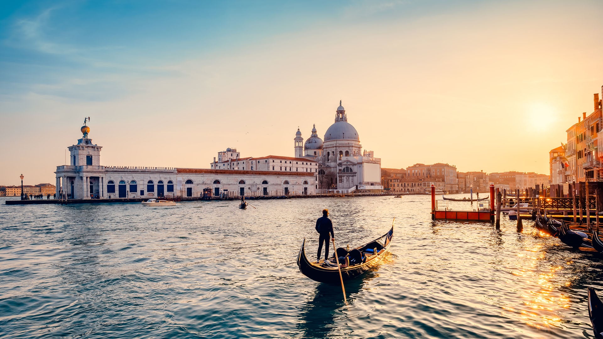 A man in a gondola in Venice, Italy