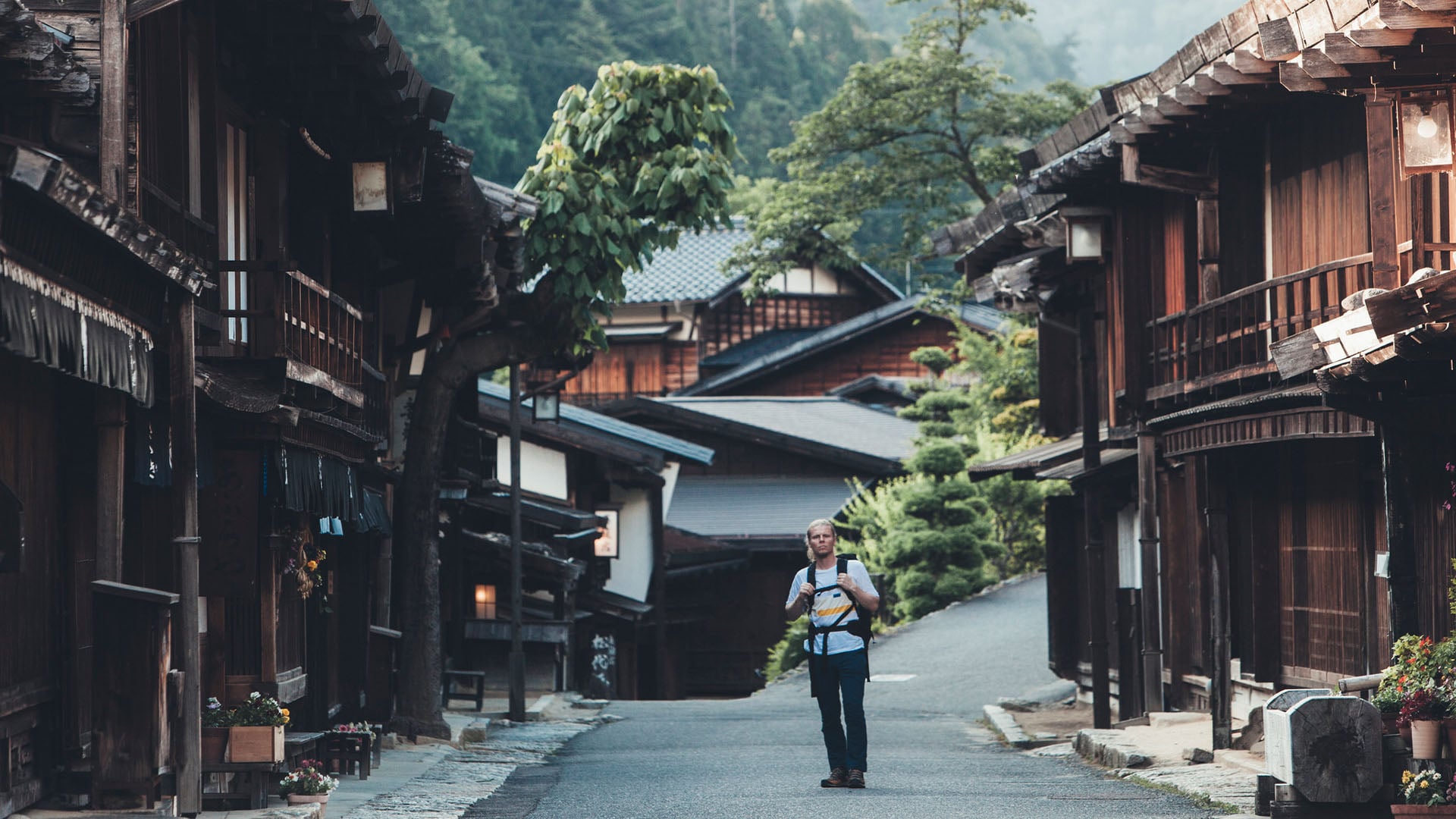 A man hikes the Nakasendo Trail in Japan