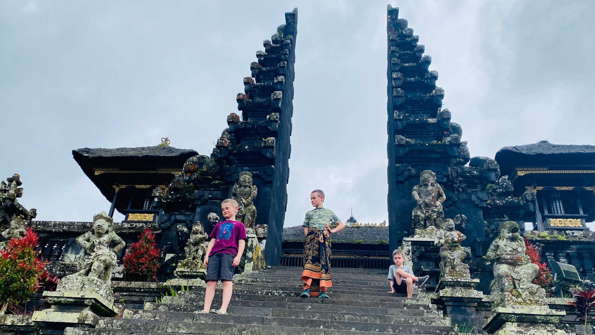 Children on the steps of a temple in Bali