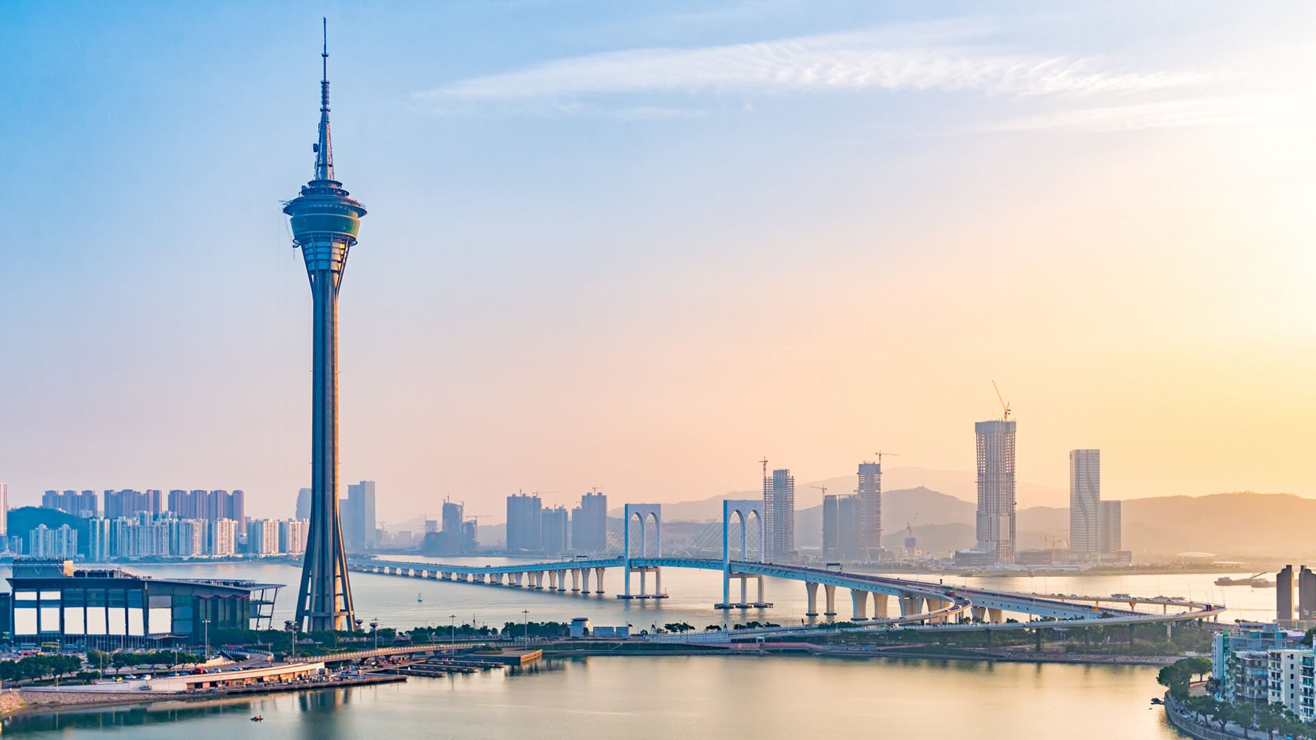 Skyline of Macau with bridges, skyscrapers, and a space needle