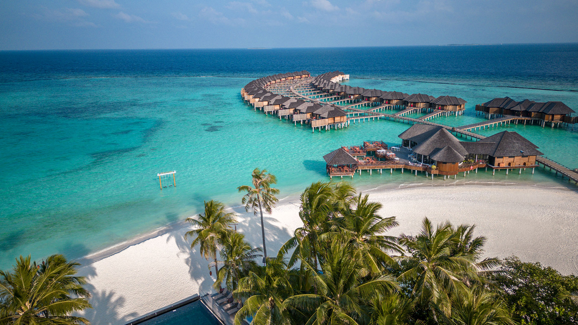 aerial view of overwater bungalows in the Maldives