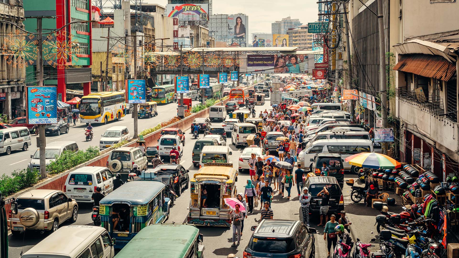 A view of street traffic on a sunny day in Manila, Philippines