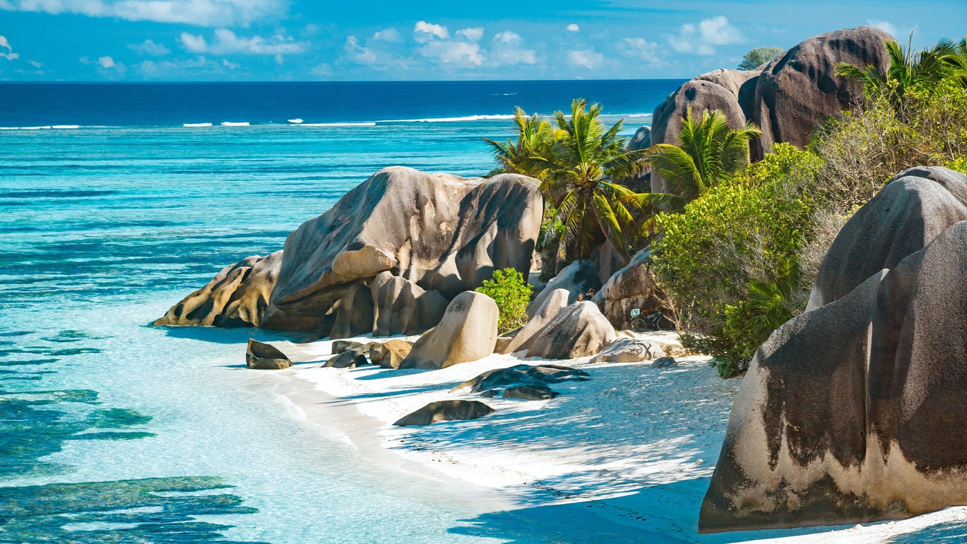 otherworldly stones, white sands, and blue waters on Anse Source D'Argent in the Seychelles