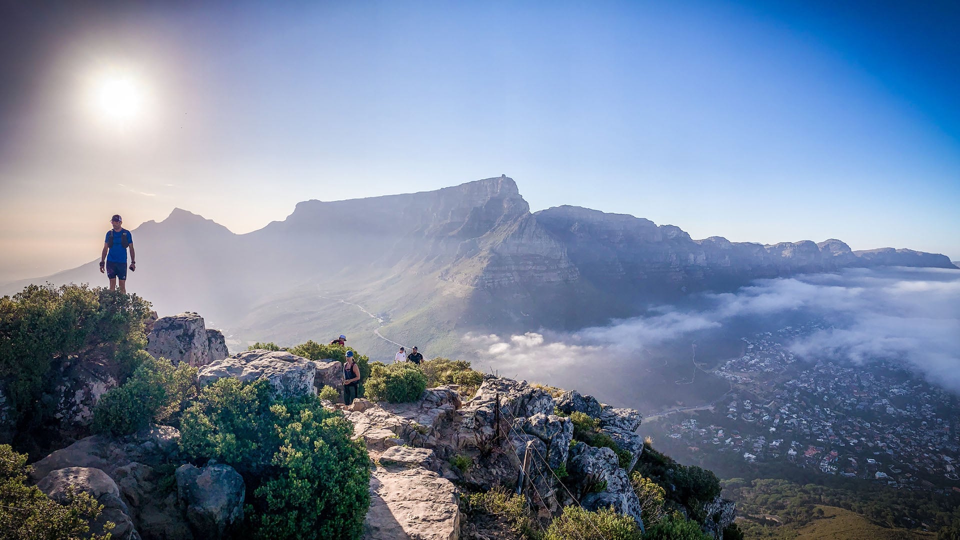 A man hiking on Table Mountain overlooking Cape Town in South Africa