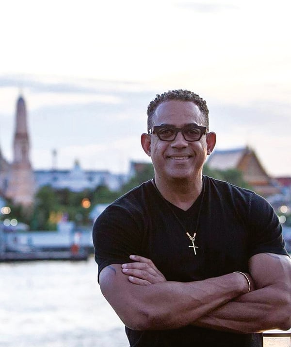 A headshot of Steve Johnson of Tourism Authority of Thailand in front of the river in Bangkok, Thailand