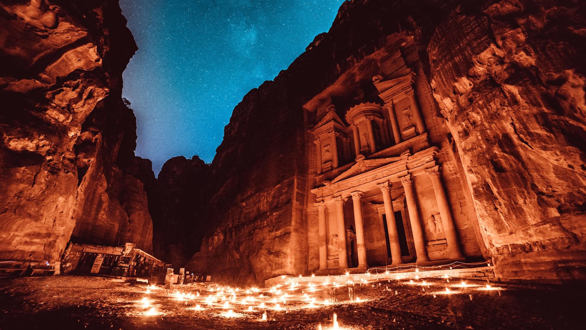 Petra's Treasury lit up at night at the Petra at Night experience in Jordan