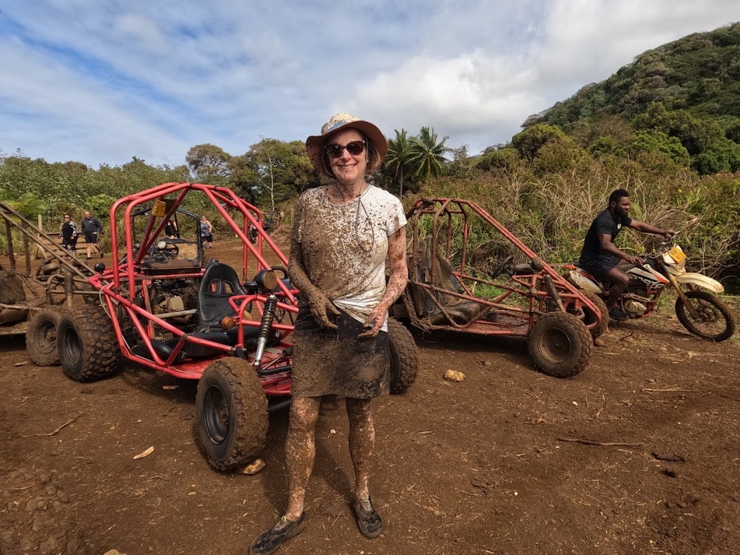 A Goway employee posing in front of dune buggies