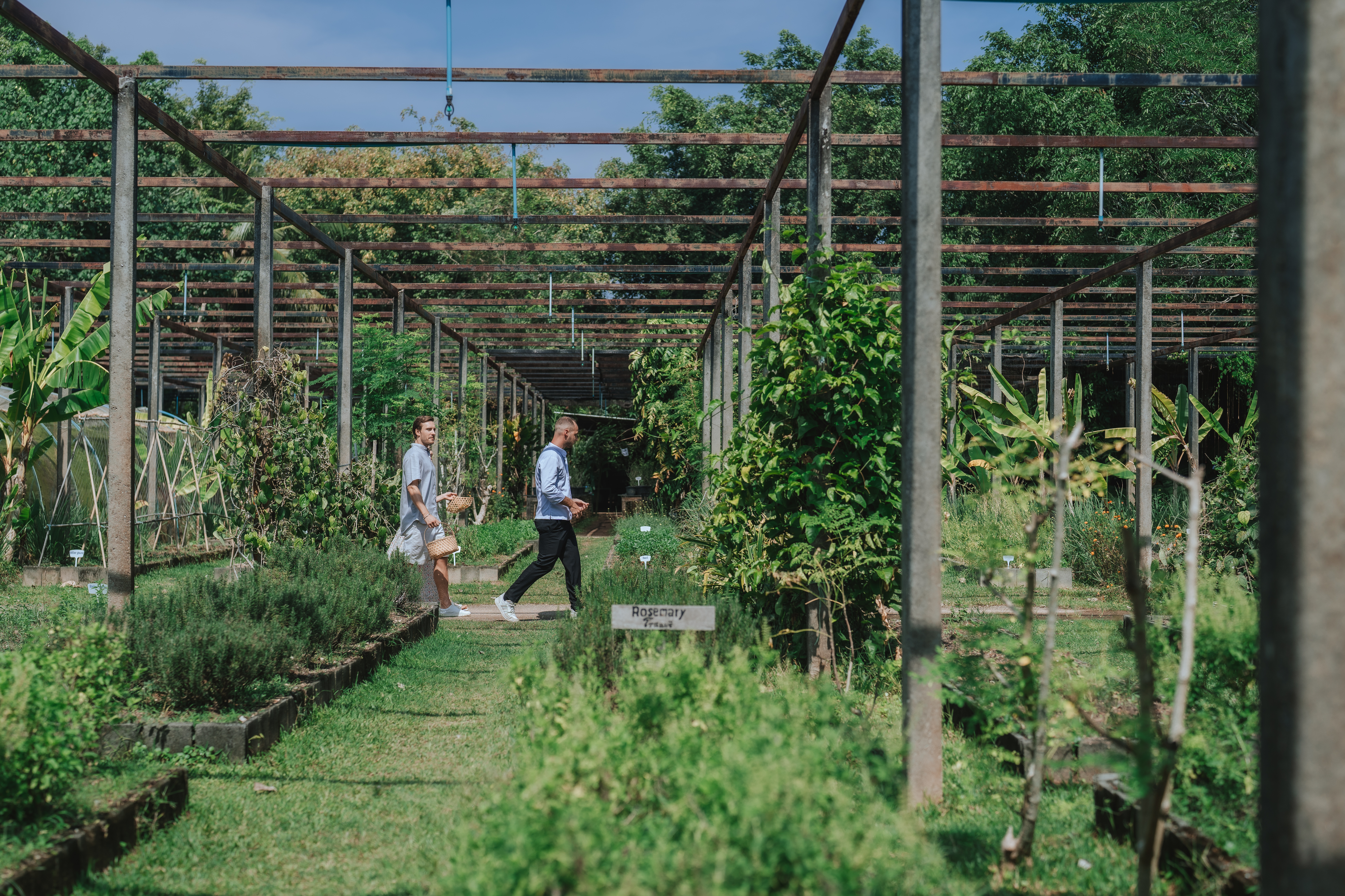 People walk through the farm at Jampa Phuket Pru in Thailand