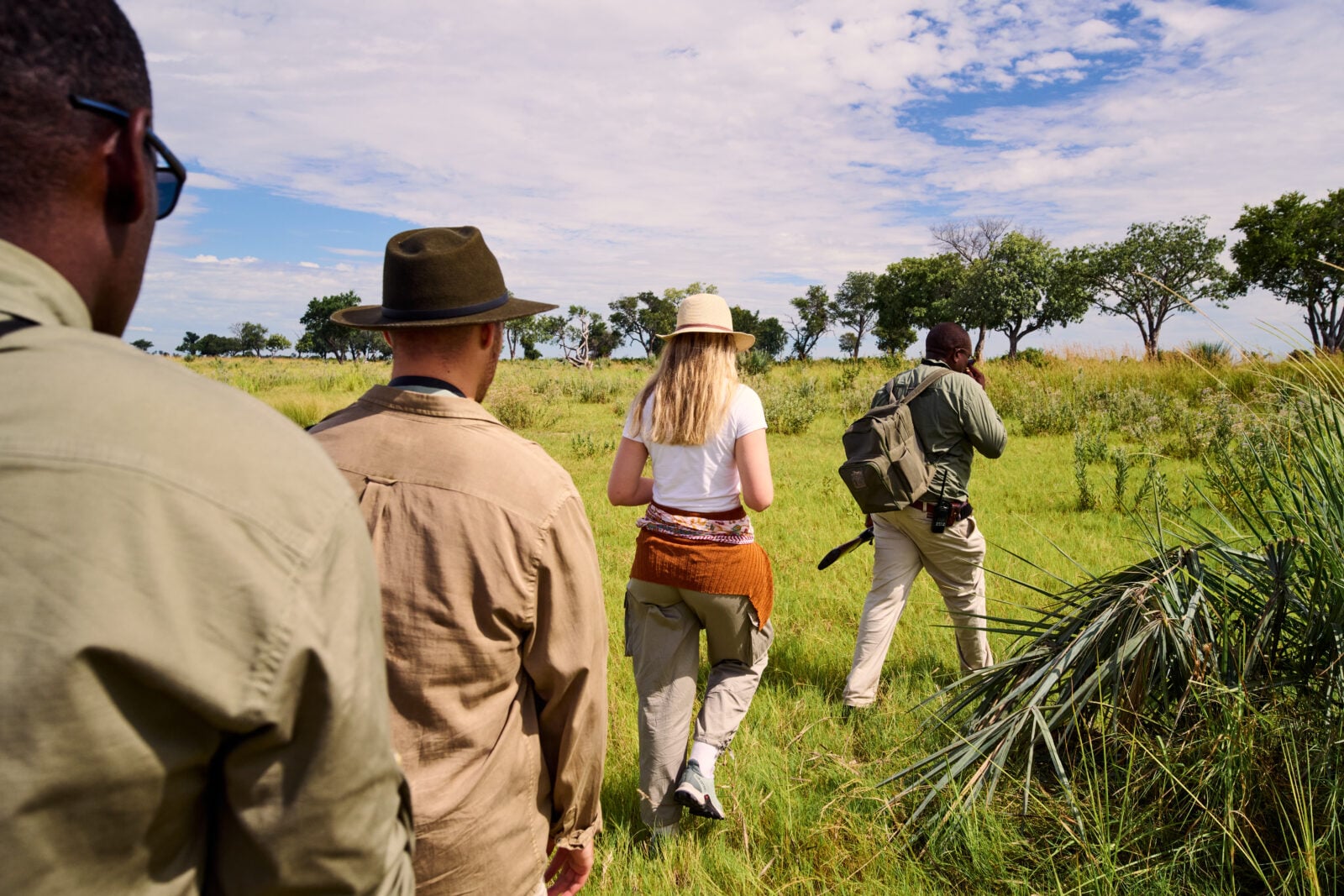 Travellers on a guided safari walk at Xugana Island Lodge in Botswana