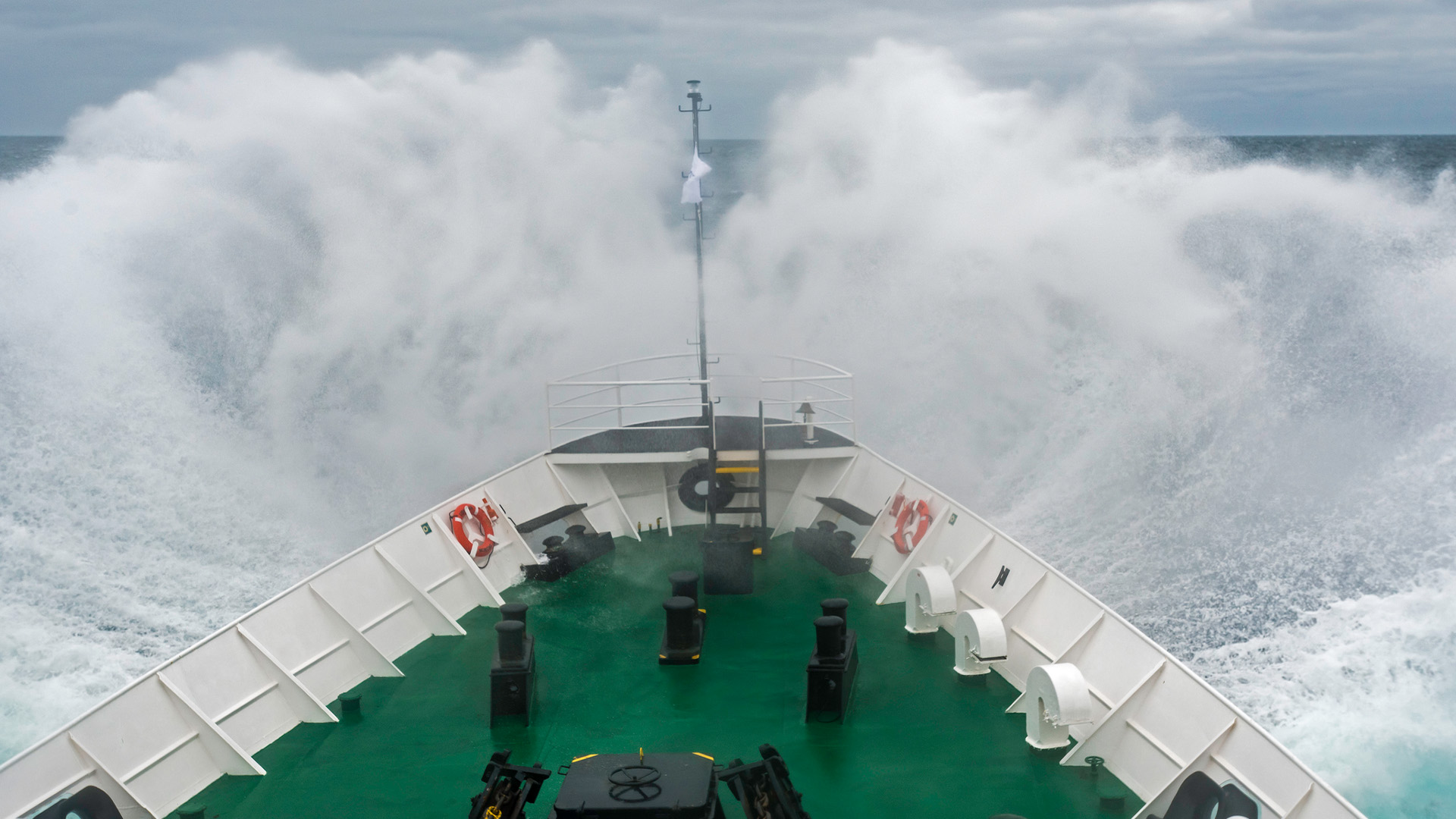 An expedition vessel cuts through the choppy waters of the Drake Passage.