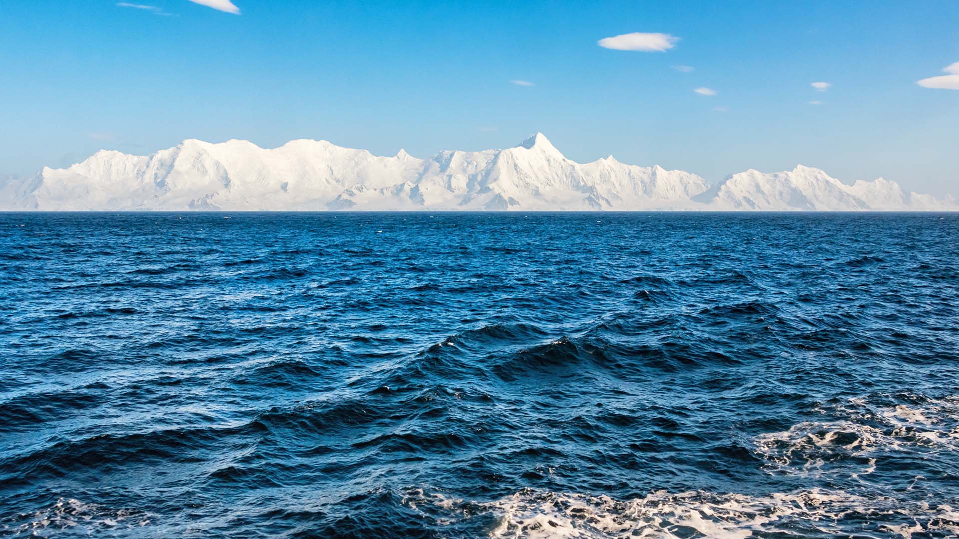 The blue waters of the Drake Passage alongside the South Shetland Islands near Antarctica.