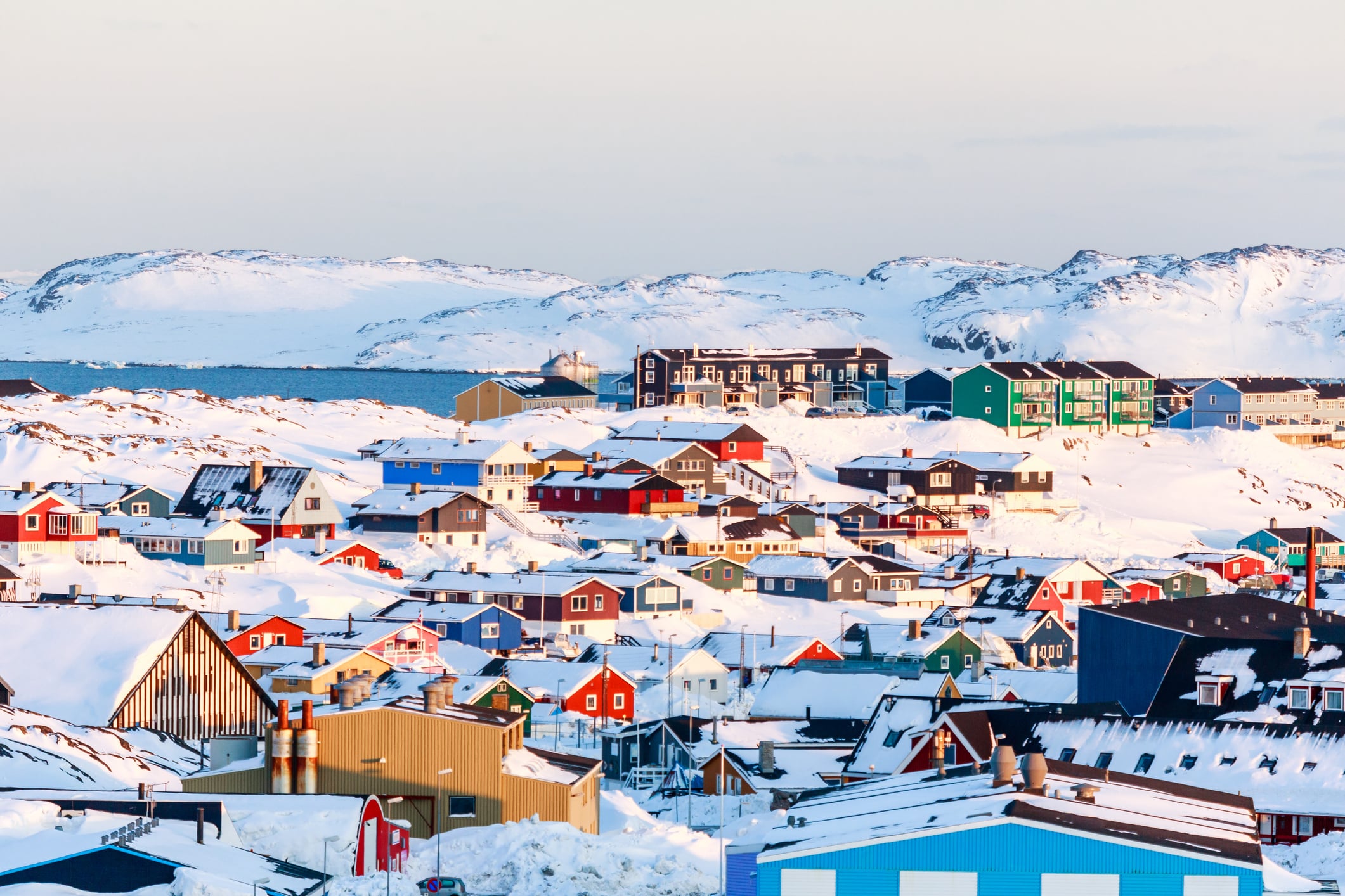 In winter, Nuuk only experiences a scant few hours of daylight each day. The winter landscape of Nuuk, the capital of Greenland.