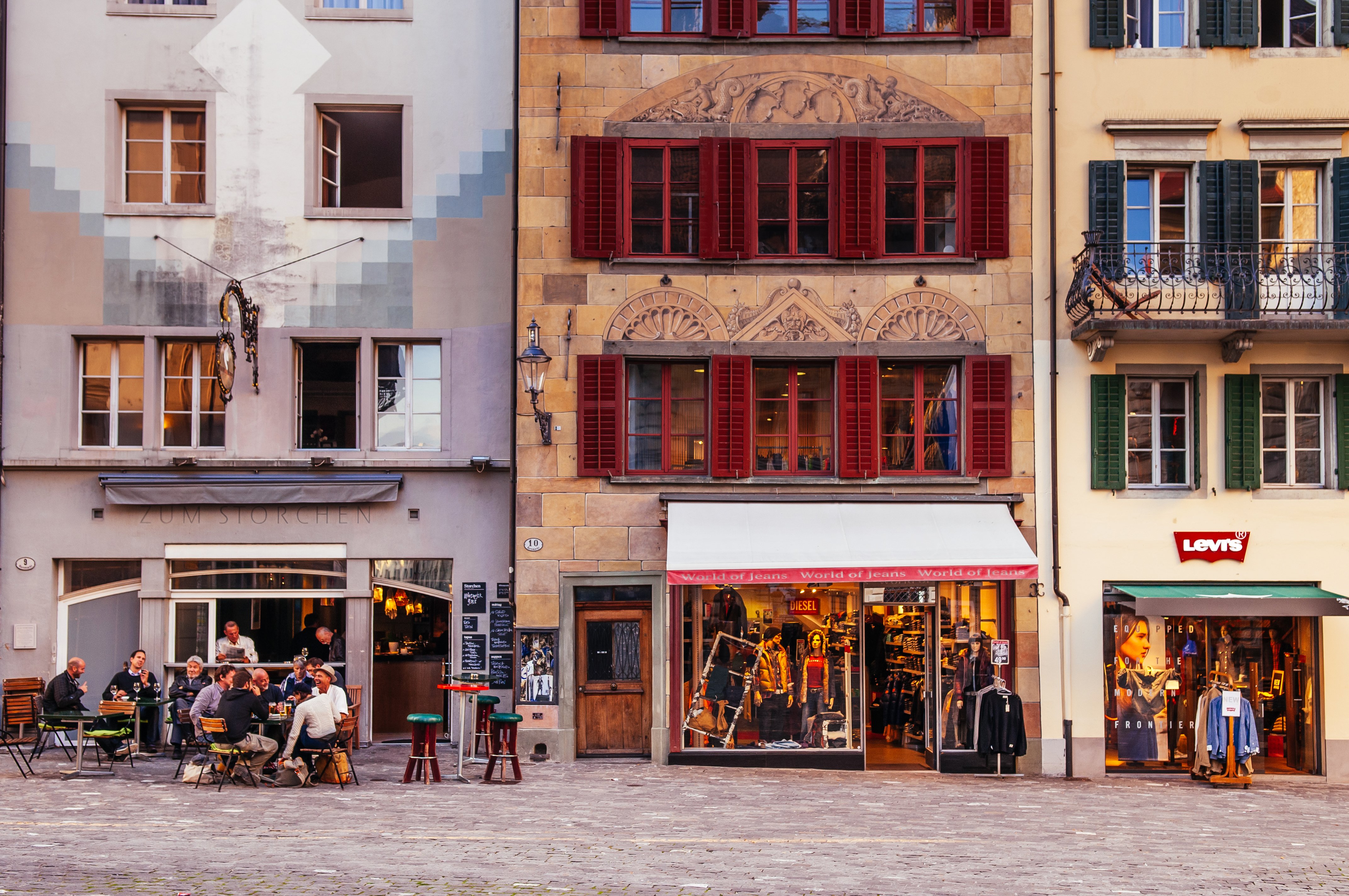 Old Town of Lucerne, Switzerland. Travellers seated outside restaurants and old vintage buildings in the Old Town of Lucerne, Switzerland.