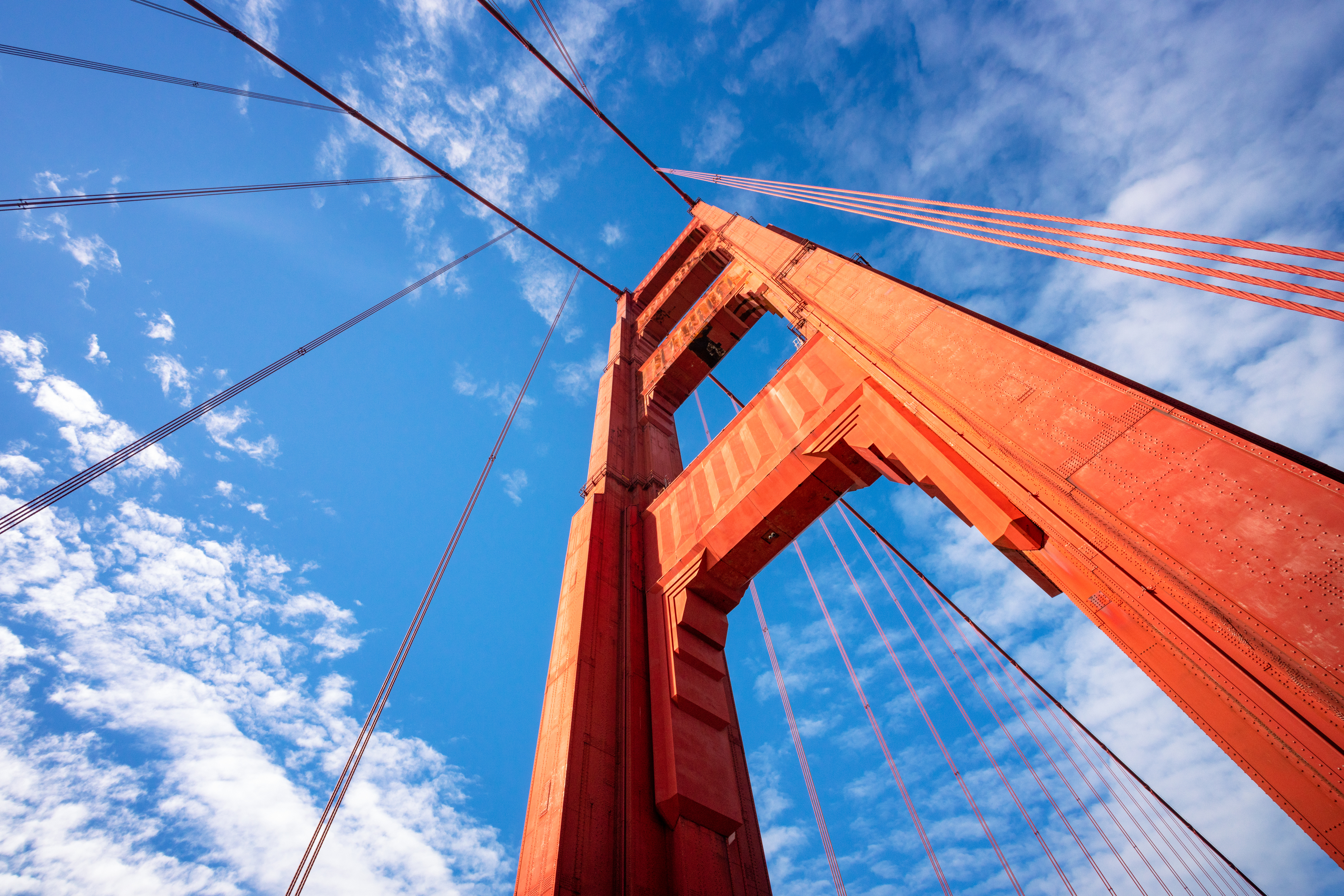 Looking up at one of the two famous towers of San Francisco's Golden Gate Bridge.
