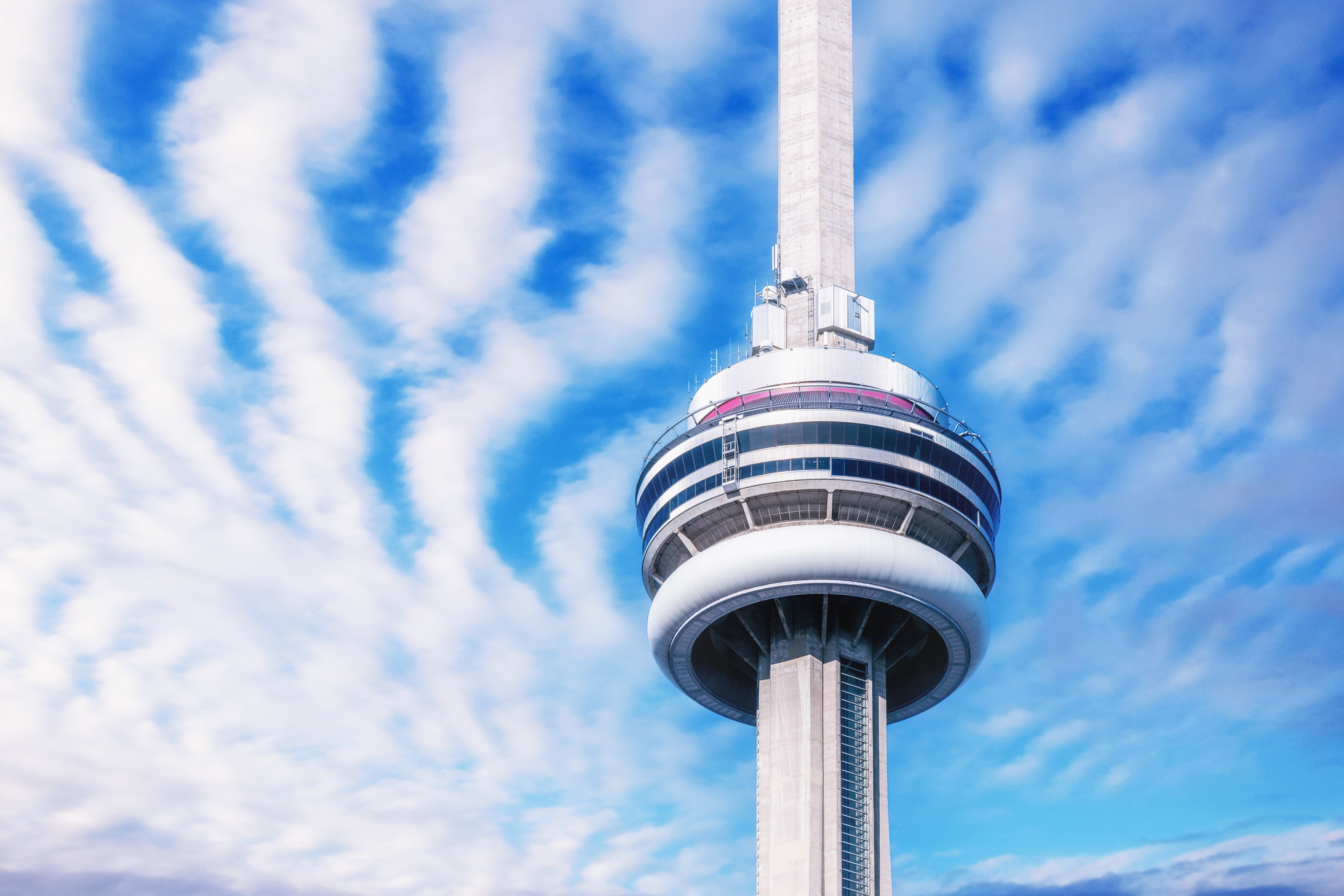 The CN Tower in a beautiful sky day. Close up of the main pod.