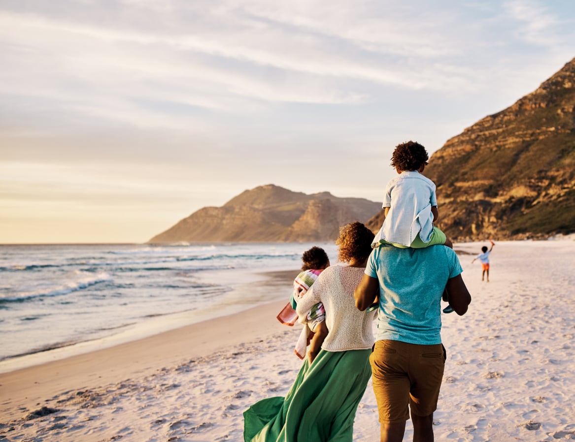 A family walks on the beach