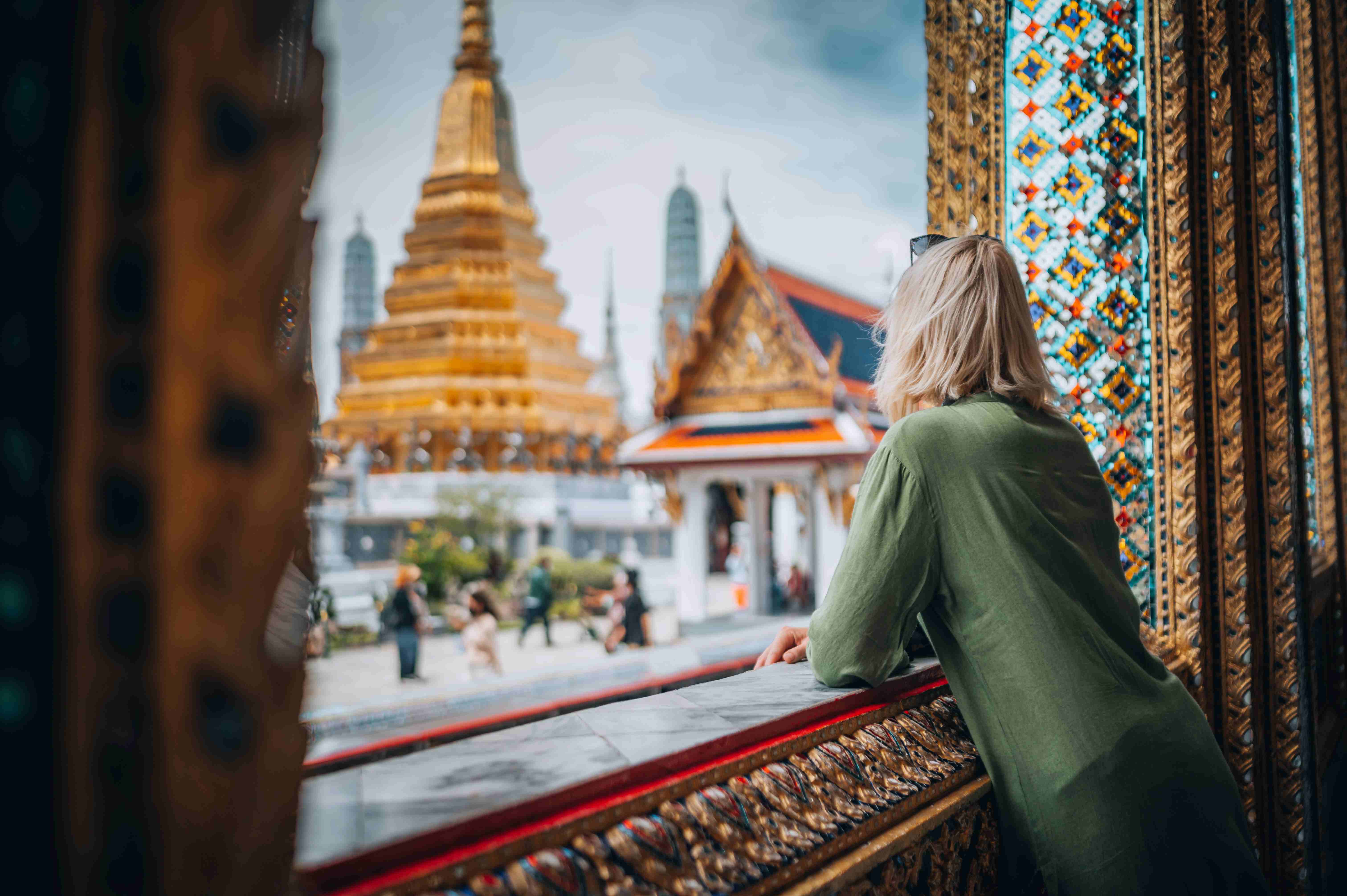 Woman exploring Grand Palace and Wat Phra Kaew in Bangkok, Thailand