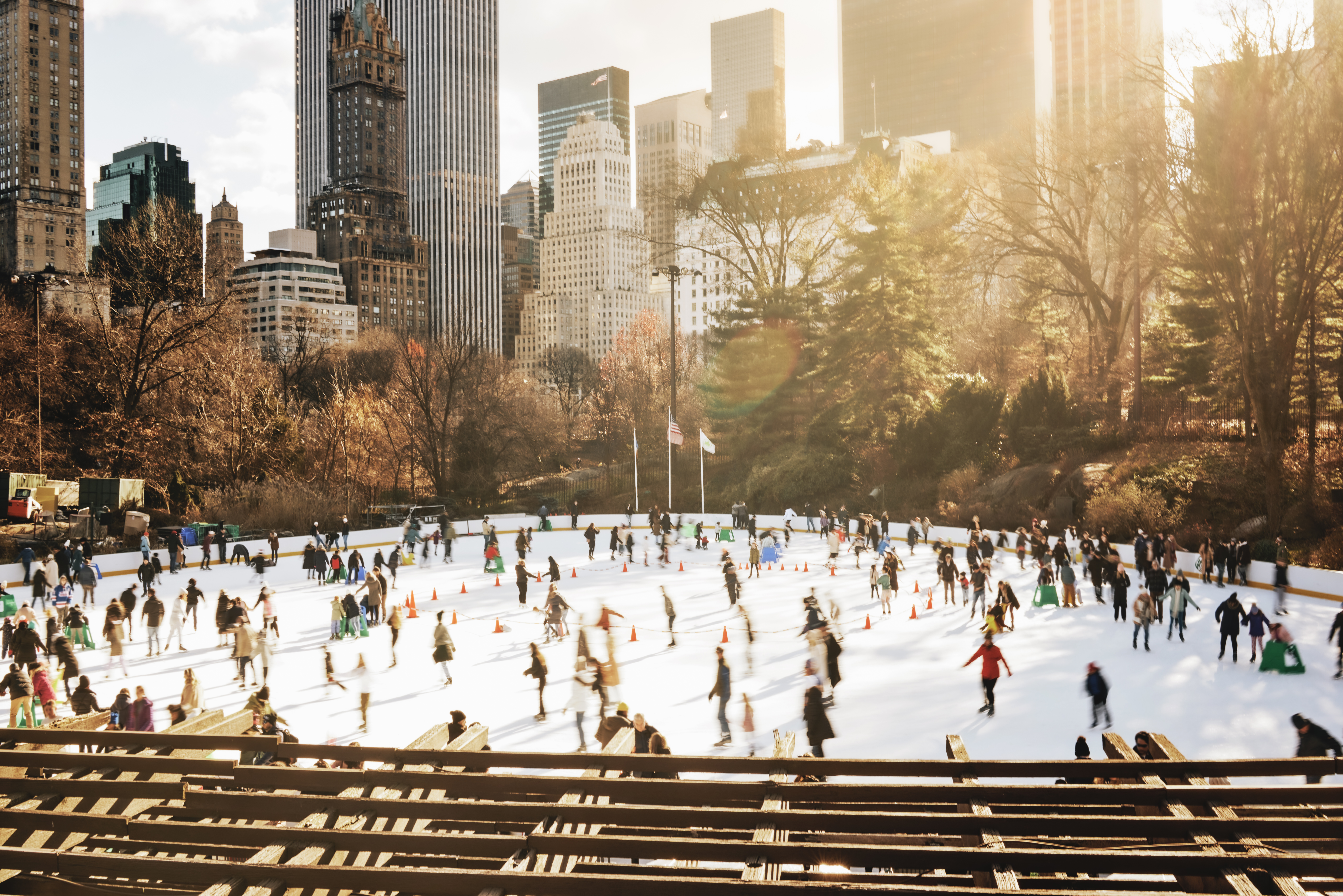 People doing ice skating in central park.