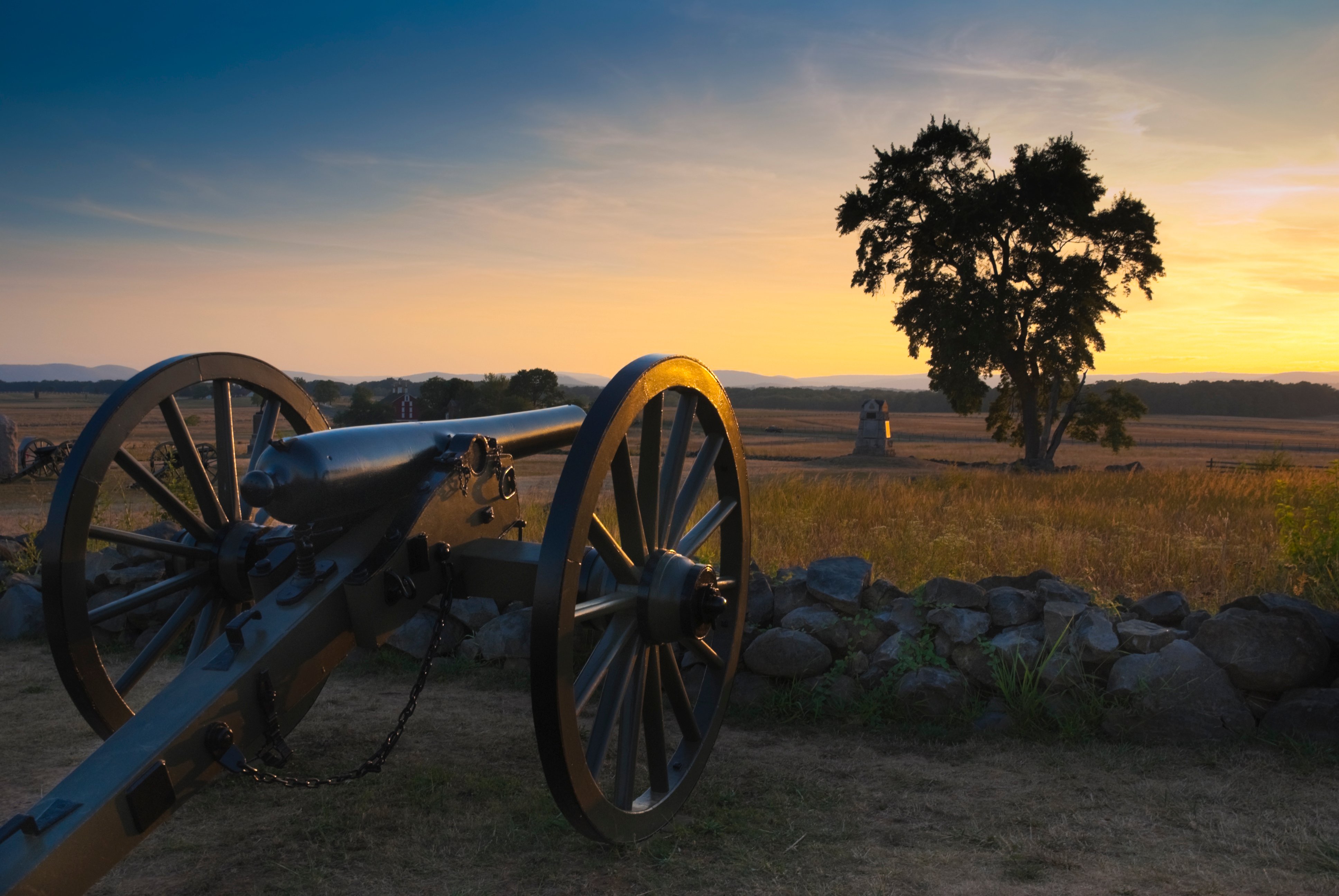 A cannon at the Gettysburg Battlefield at sunset.