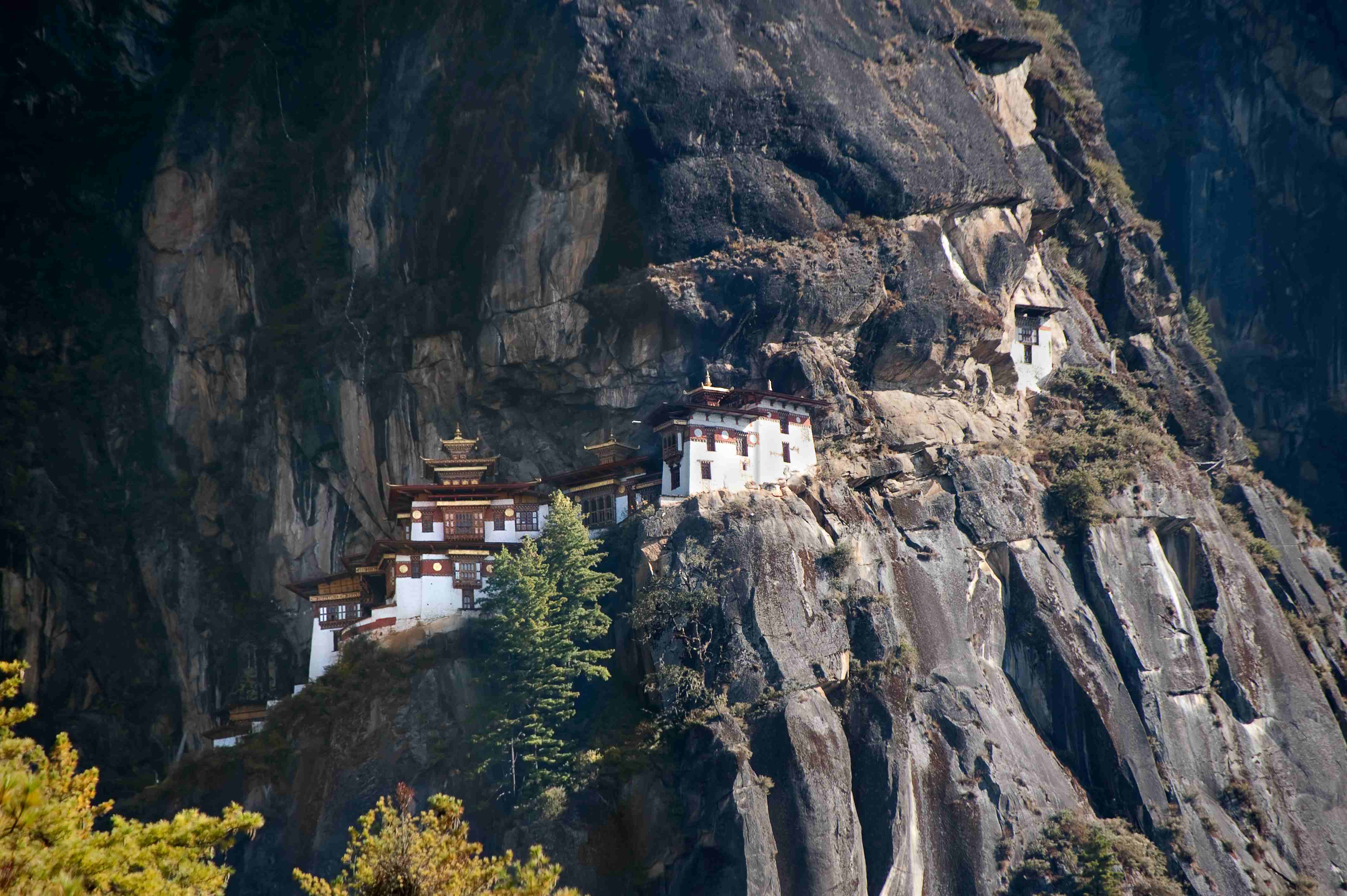 Taktshang, “the Tiger’s Nest” in the Paro Valley, is one of the most sacred sites in Bhutan. The monastery clings to the black rock, overhangeing the valley below by 800 meters (2.600 feet)