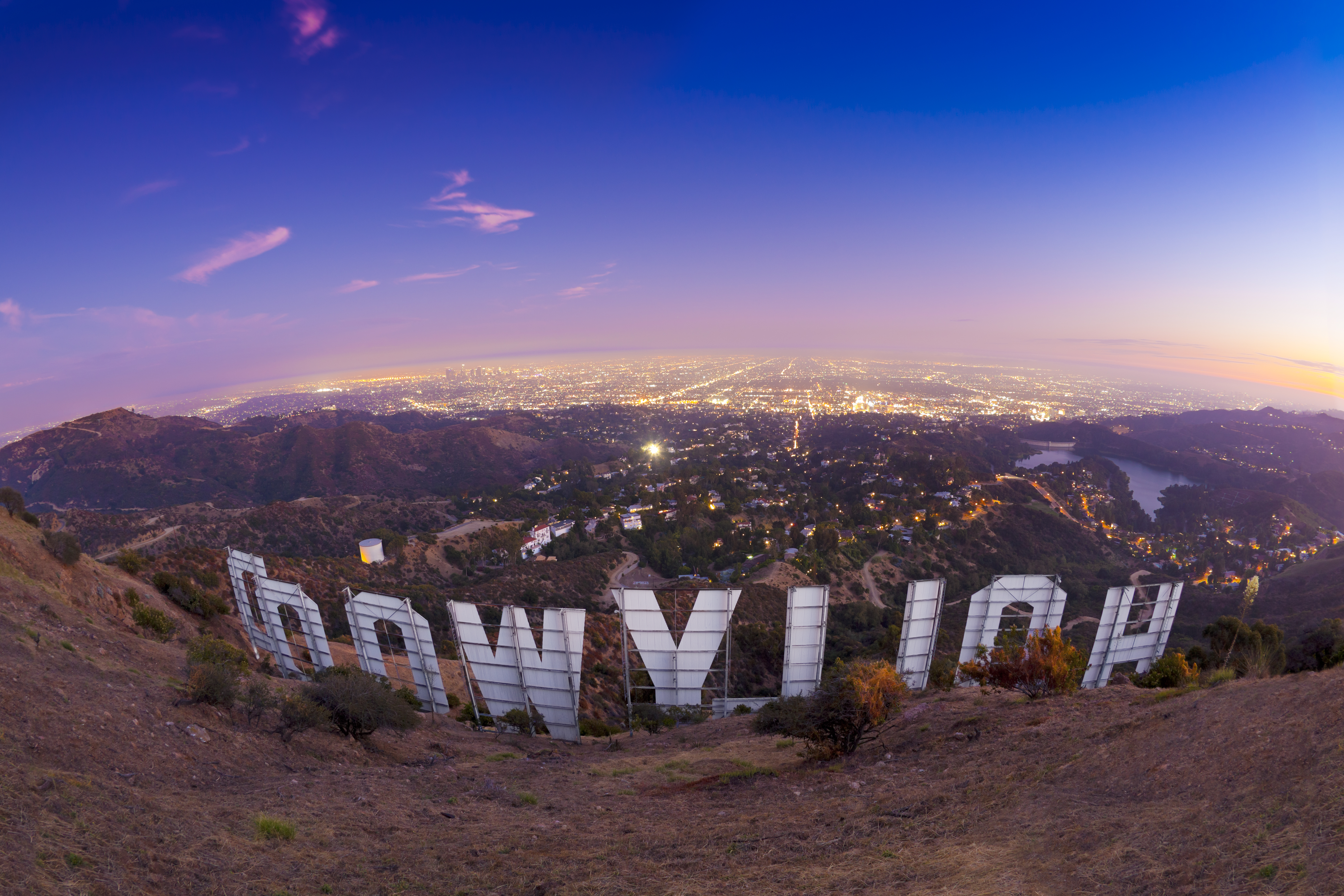 A long exposure photograph taken from a hiking trail behind the Hollywood Sign.