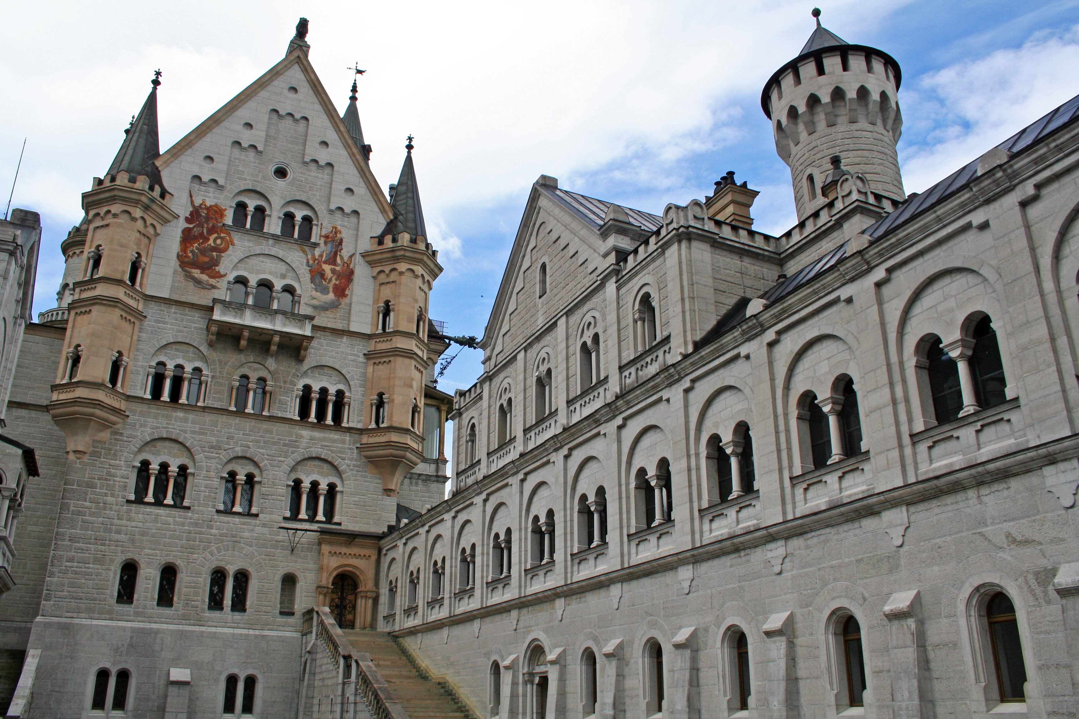 The upper courtyard of Neuschwanstein Castle with the Palasfront on the left and the Knights' House on the right