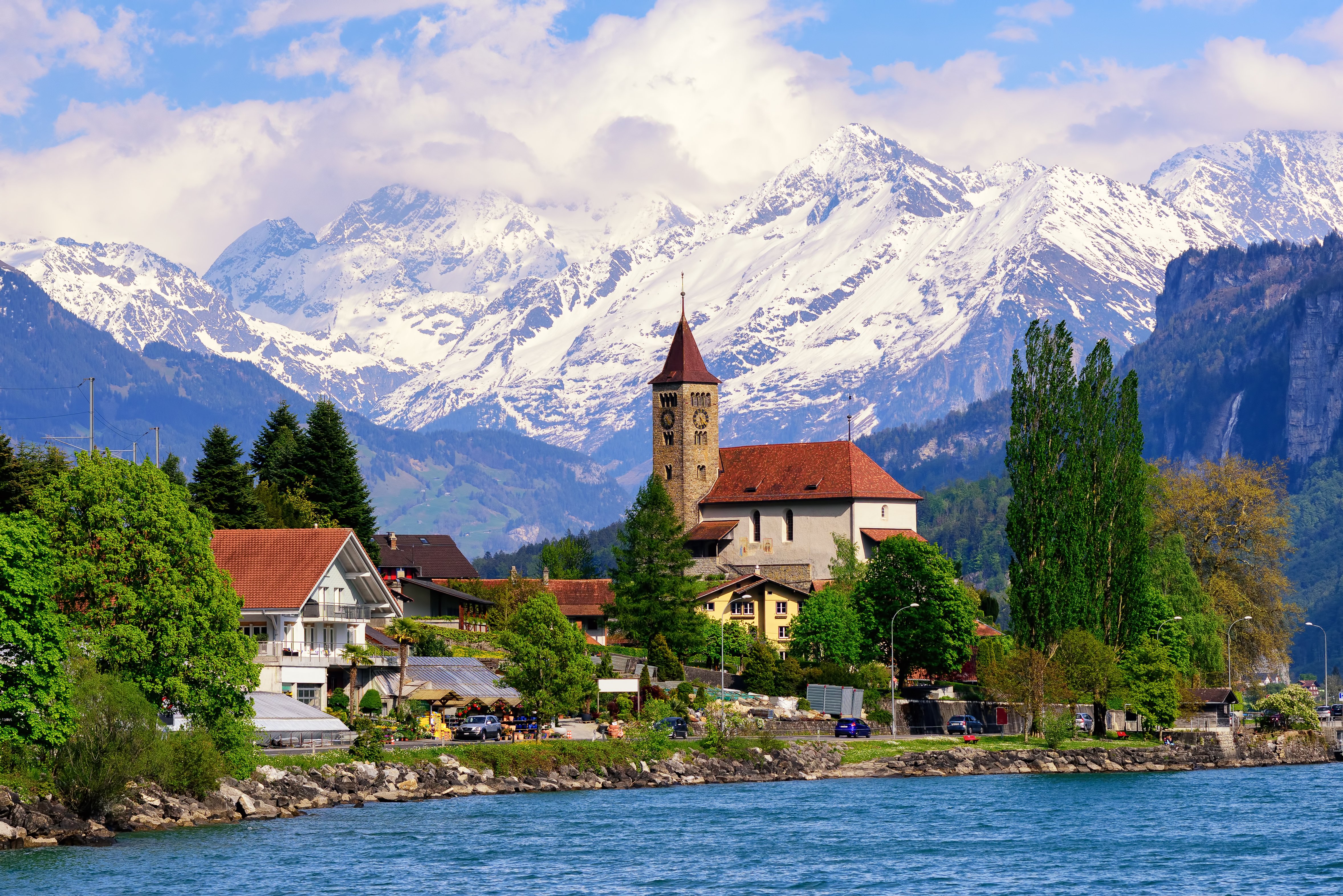 Brienz, Interlaken, Switzerland Brienz town near Interlaken and snow covered Alps mountains, Switzerland