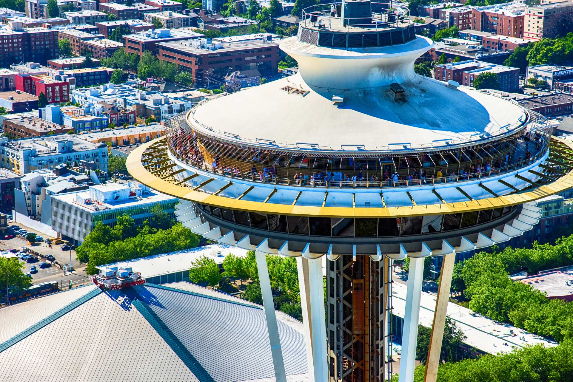 Close up of tourists gathered on the viewing deck of the Space Needle in Seattle Washington as shot from an orbiting helicopter.