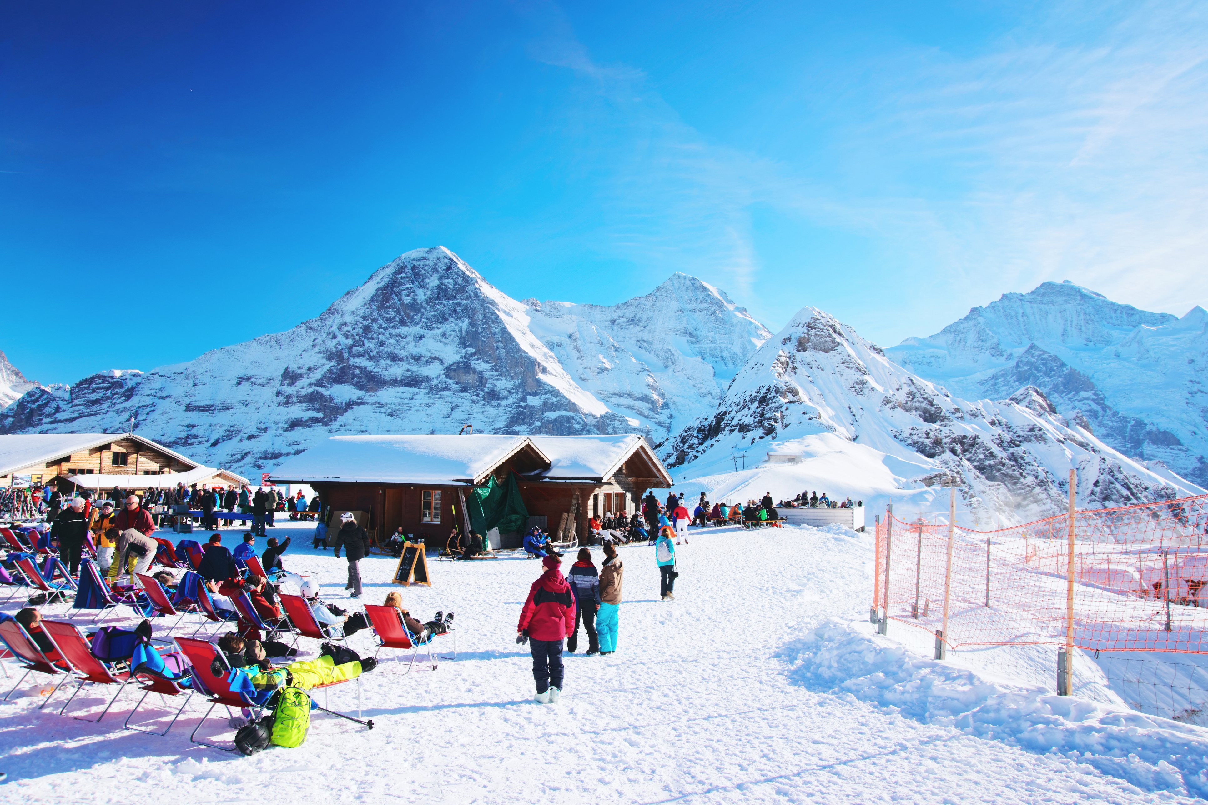 Swiss Alps, Interlaken, Switzerland Mannlichen mountain and resort with tourists during winter in the Swiss Alps, Interlaken, Switzerland.