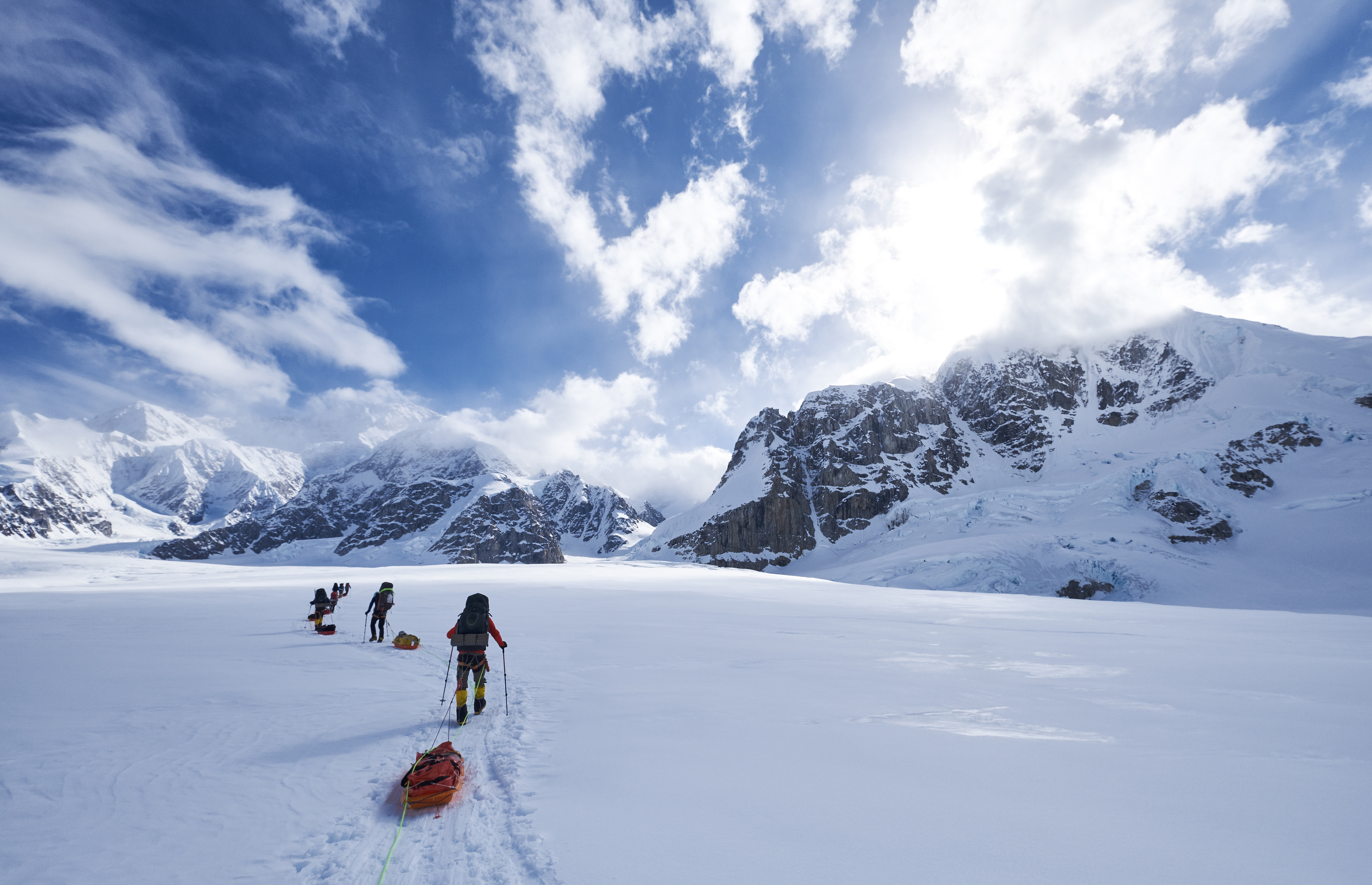 Mountaineers climbing Denali pulling a sled over the glacier on the West Buttress route