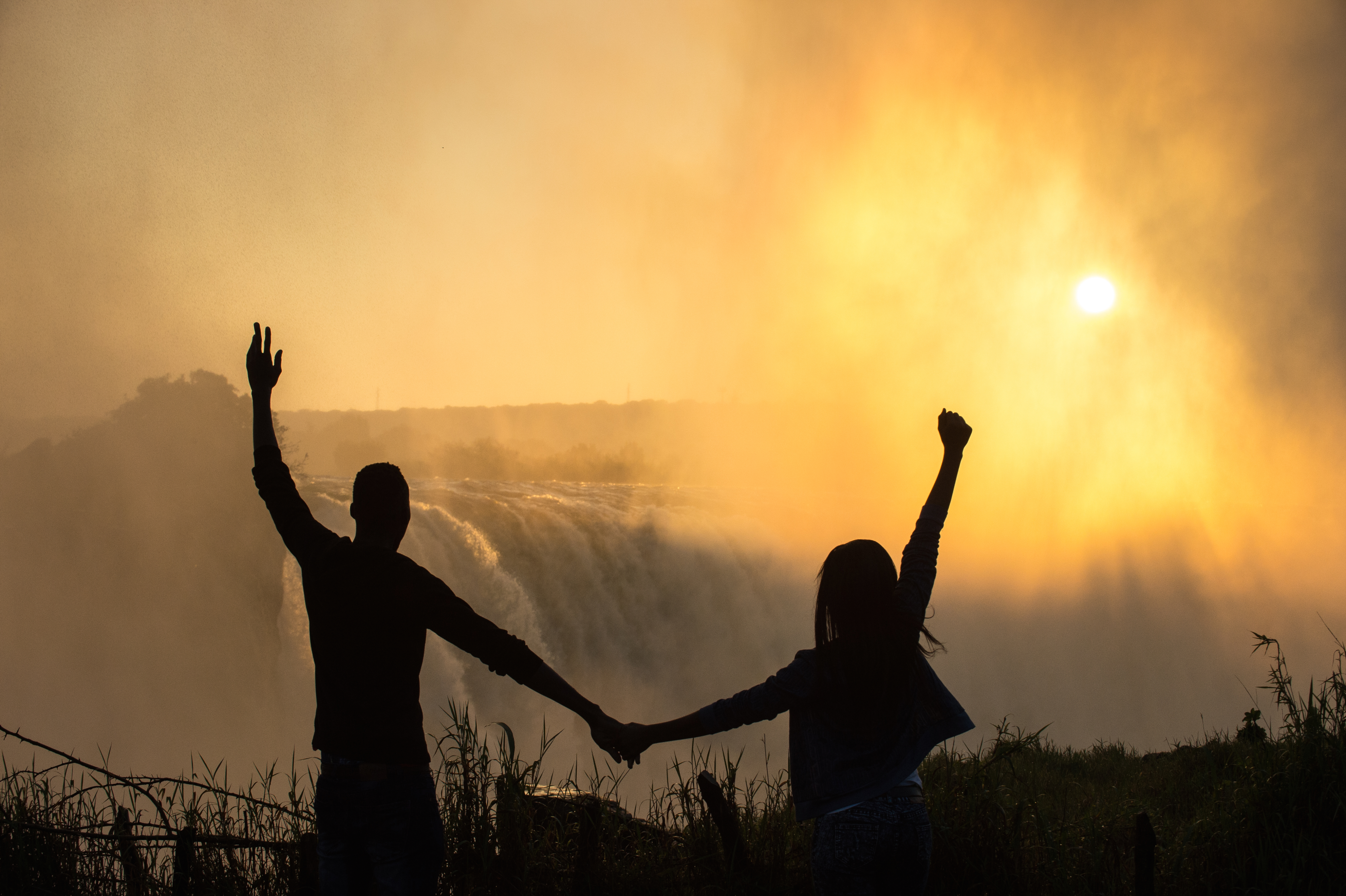 silhouette of couple at Victoria Falls