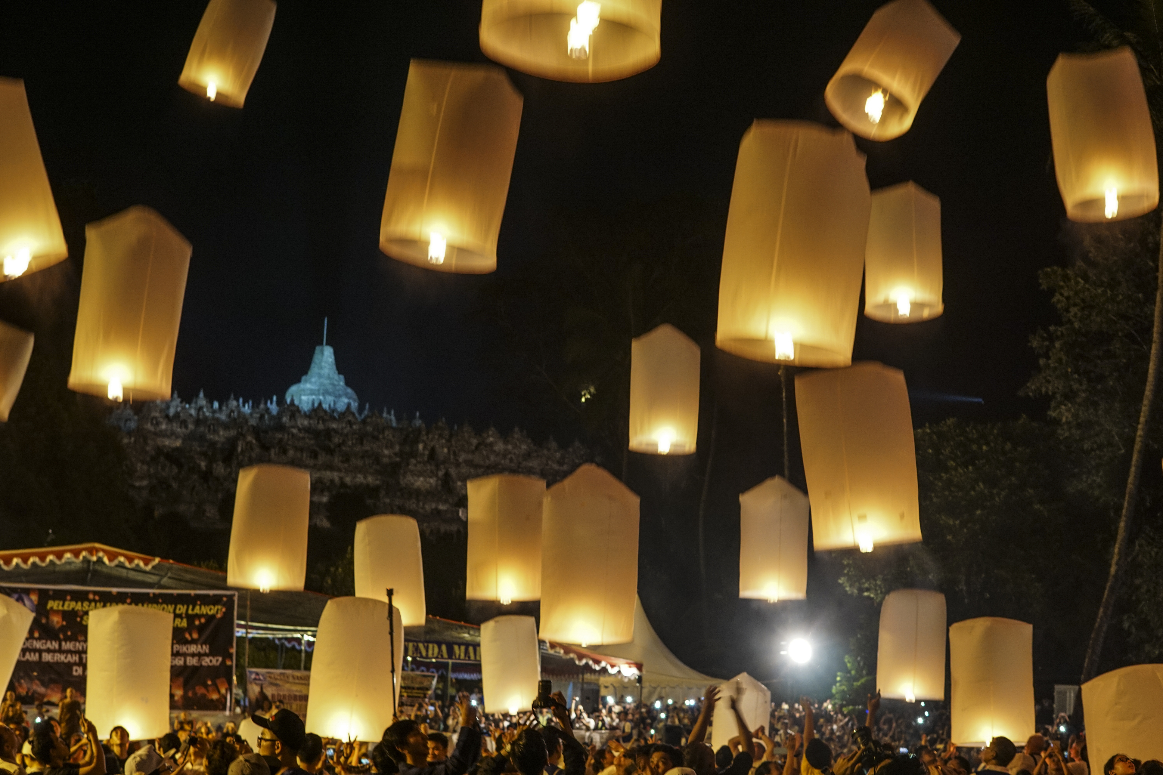 Buddhist followers and visitors release lanterns at Borobudur temple during the celebration for Vesak Day