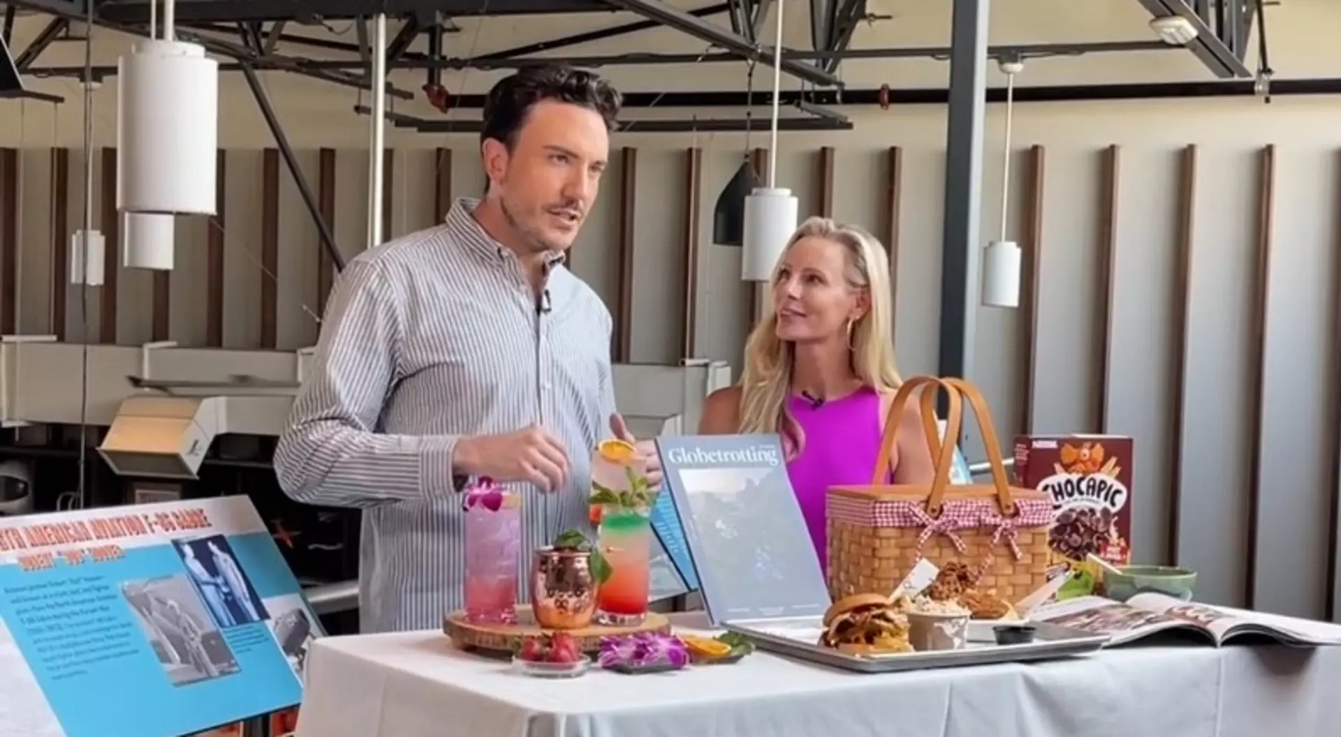 Mitchell Fawcette, Editor-in-Chief of Globetrotting Magazine, and Amber Pfister of NBC's California Live smiling before their local news segment.