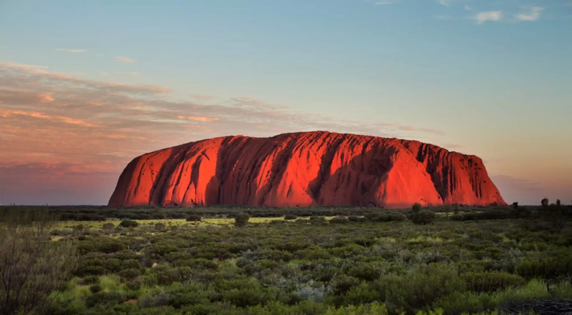 Wide shot of Uluru at sunset