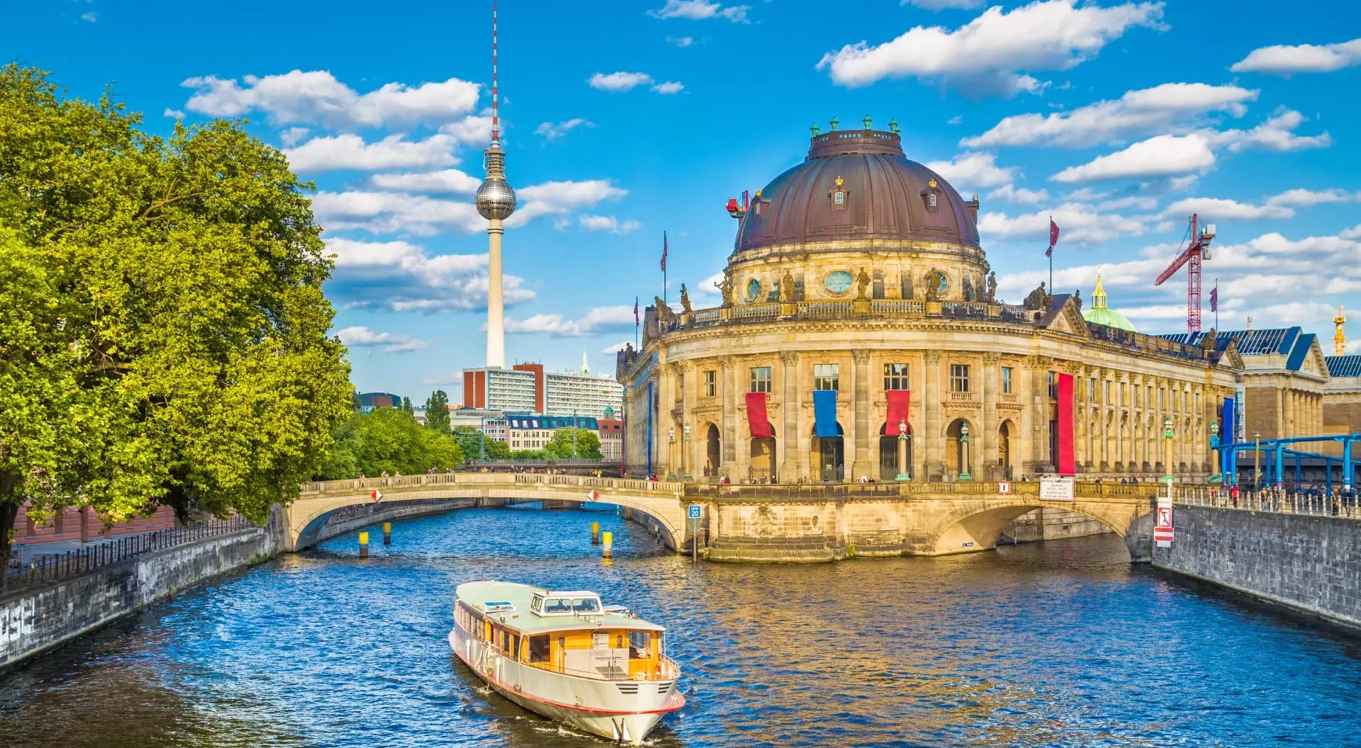 Beautiful view of UNESCO World Heritage Site Museumsinsel (Museum Island) with excursion boat on Spree river, Berlin, Germany
