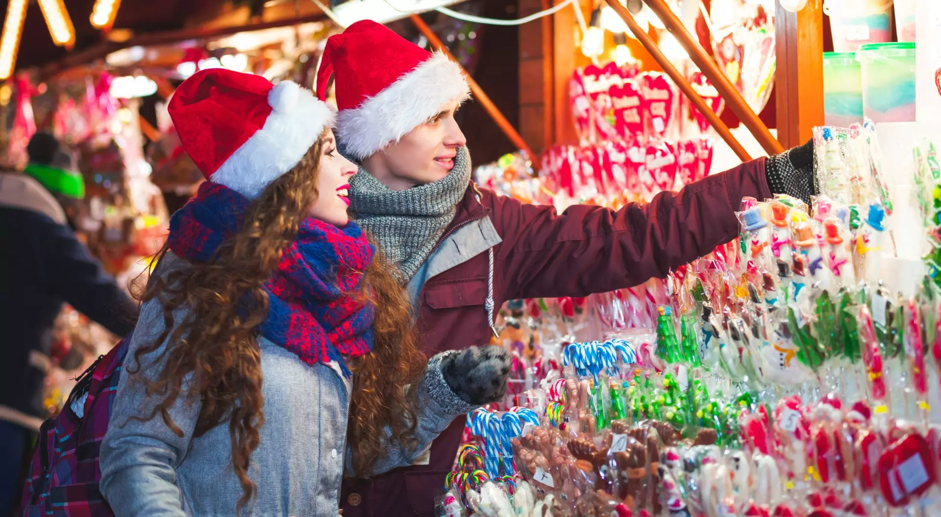 Young couple shopping at Christmas market in Germany