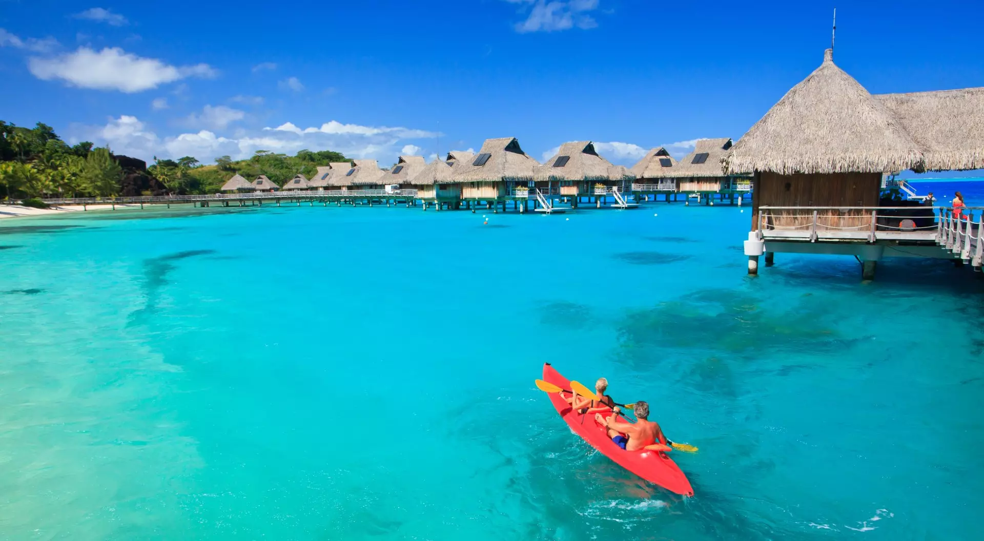 Couple Kayaking in the Blue Lagoon Bora Bora Tahiti French Polynesia South Pacific