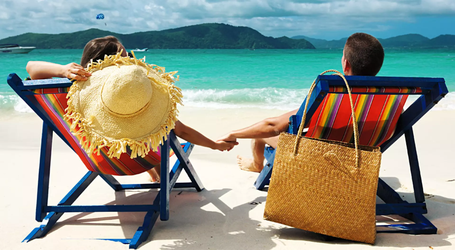 Couple holding hands on a Beach in Phuket, Thailand