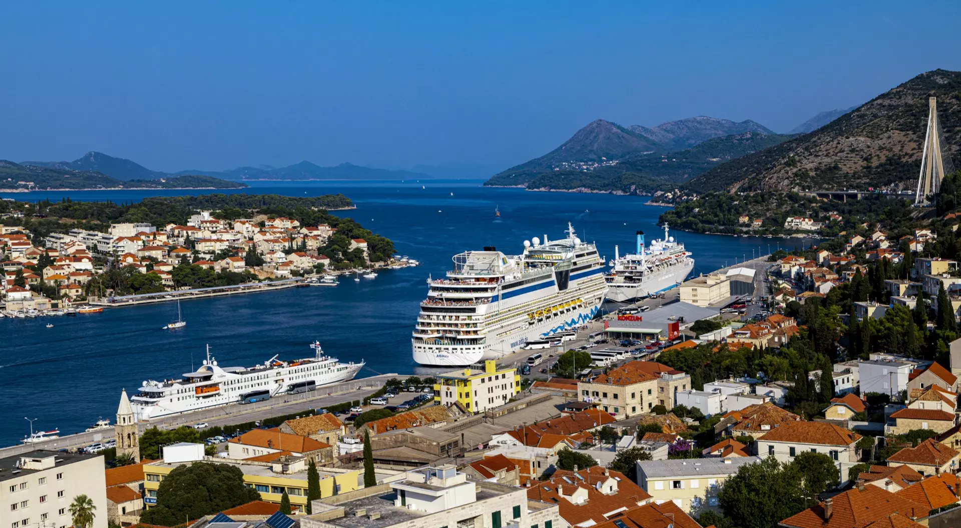 Croatia Cruise Ships with a panoramic view from the hillside of the harbour and the surrounding hills.