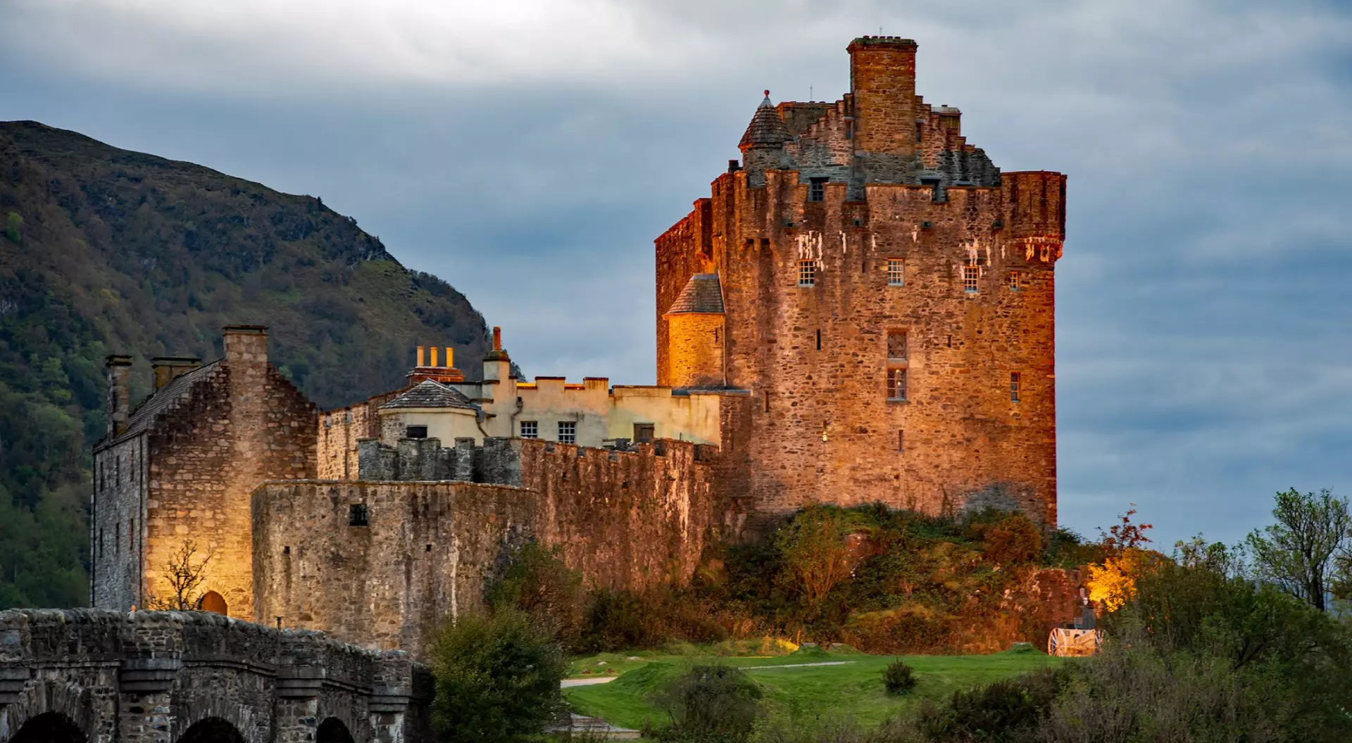 Eilean Donan Castle, Scotland, UK Eilean Donan Castle against sunset in Scottish Highlands, Scotland, UK (United Kingdom)