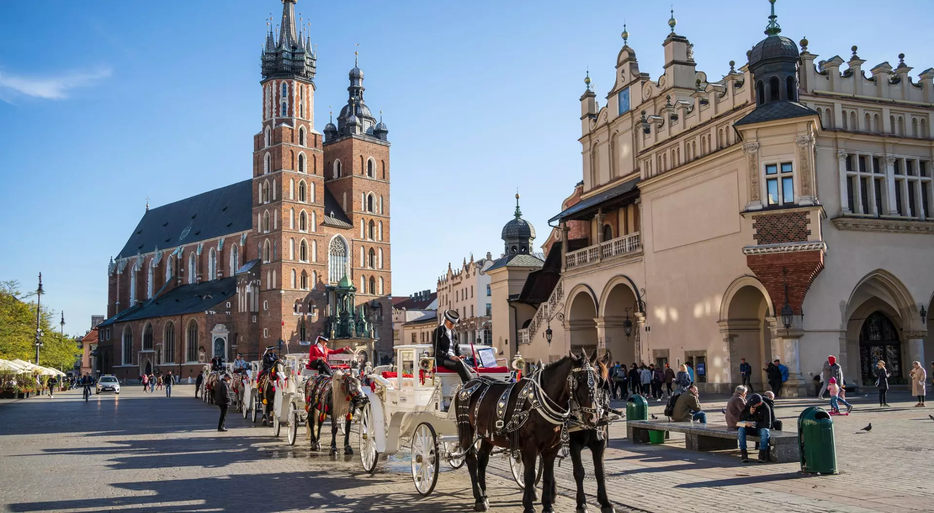 Krakow, Poland Horse Carriages at Main Market Square in Krakow in a summer day, Poland