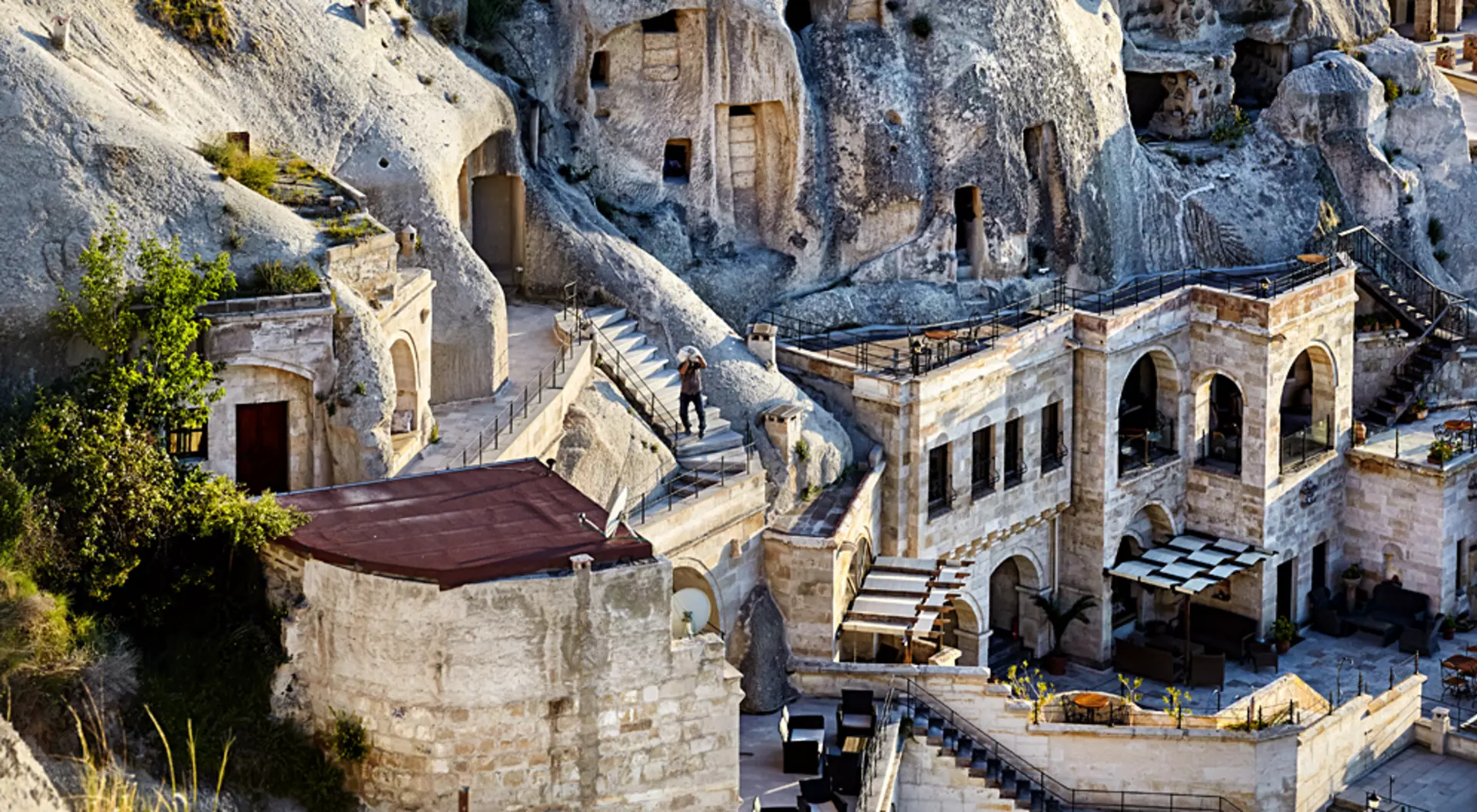 Hotel boutique in the Tufa Mountains at sunset in Goreme city, Cappadocia, Turkey
