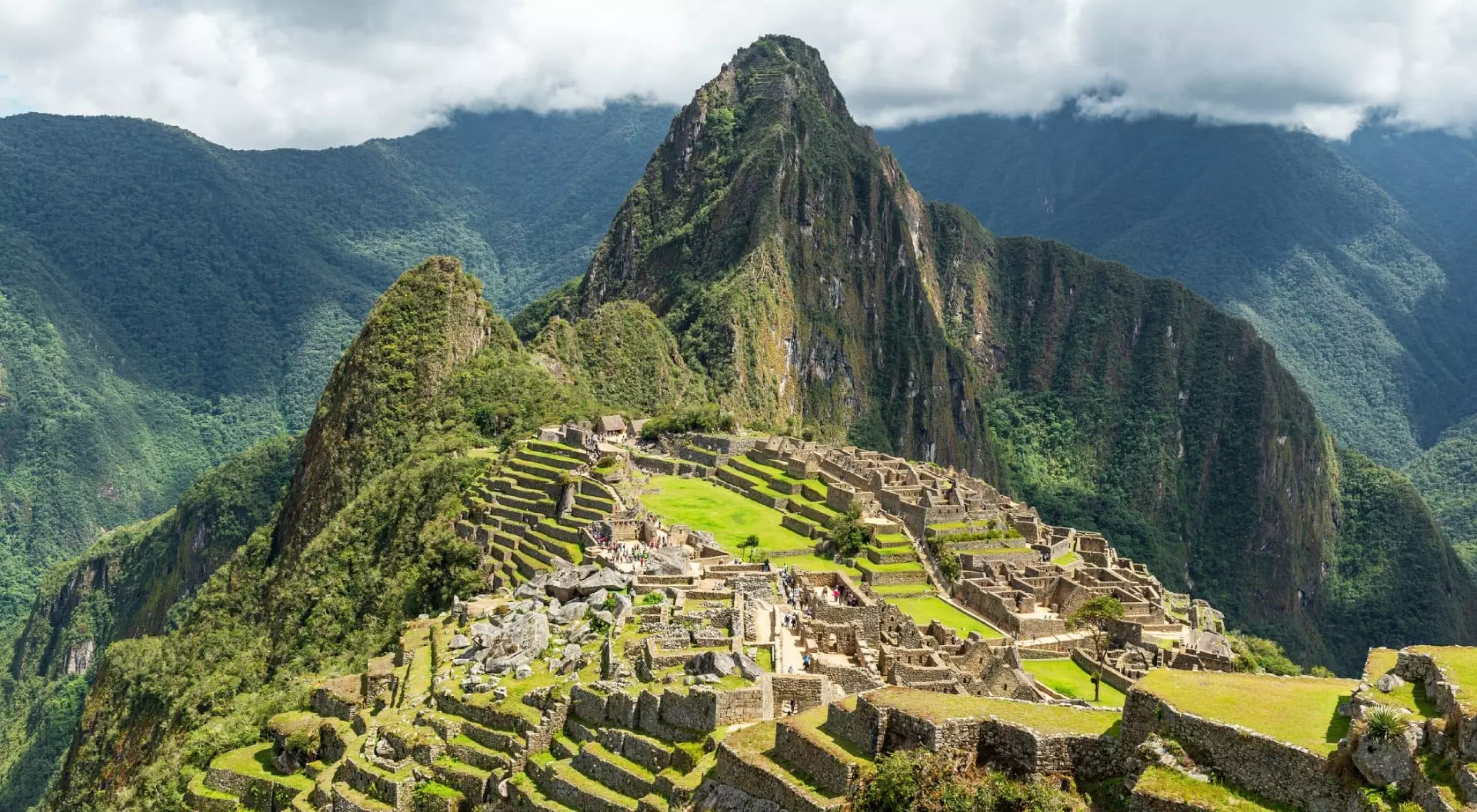 Machu Picchu Inca ruin with dramatic sky, Historic Sanctuary of Machu Picchu, Cusco, Peru.