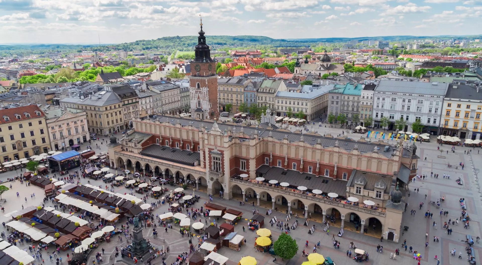 Market Square with Cloth Hall and City Hall Tower in Krakow, Poland Trip